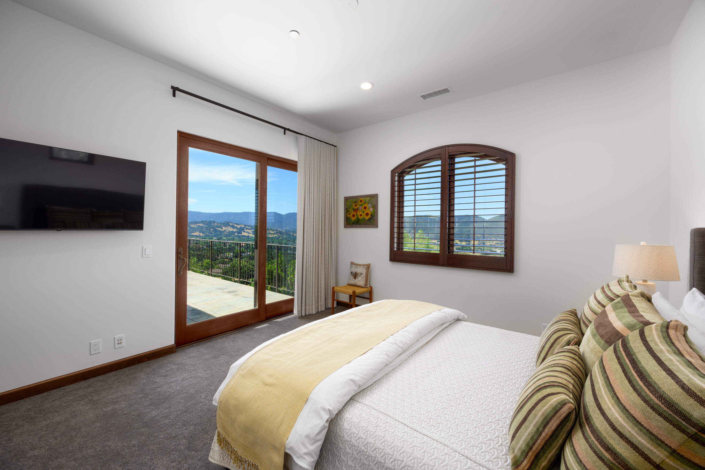 1418 Ribe Road Solvang, CA 93463 - Photo 17 of 46 a bedroom with a bed and glass floor
