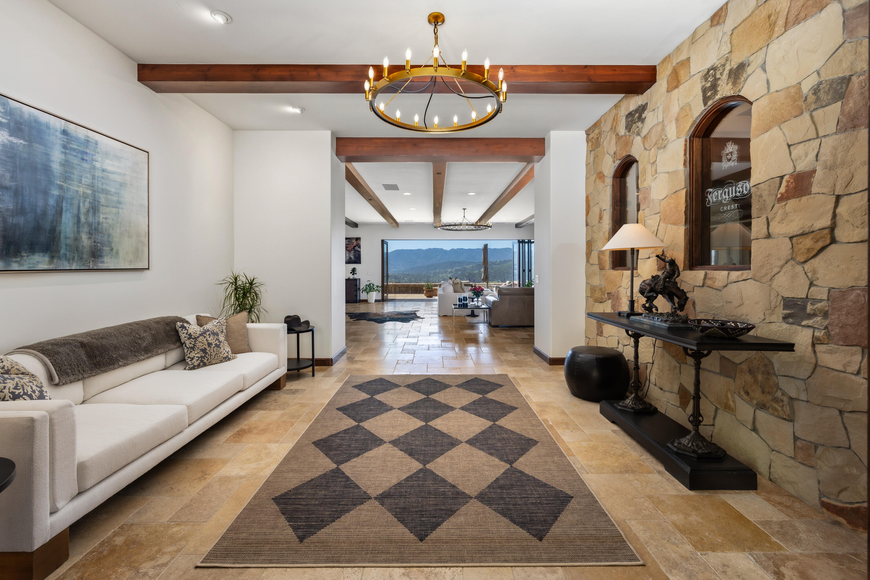 1418 Ribe Road Solvang, CA 93463 - Photo 7 of 46 a living room with furniture a rug and a chandelier