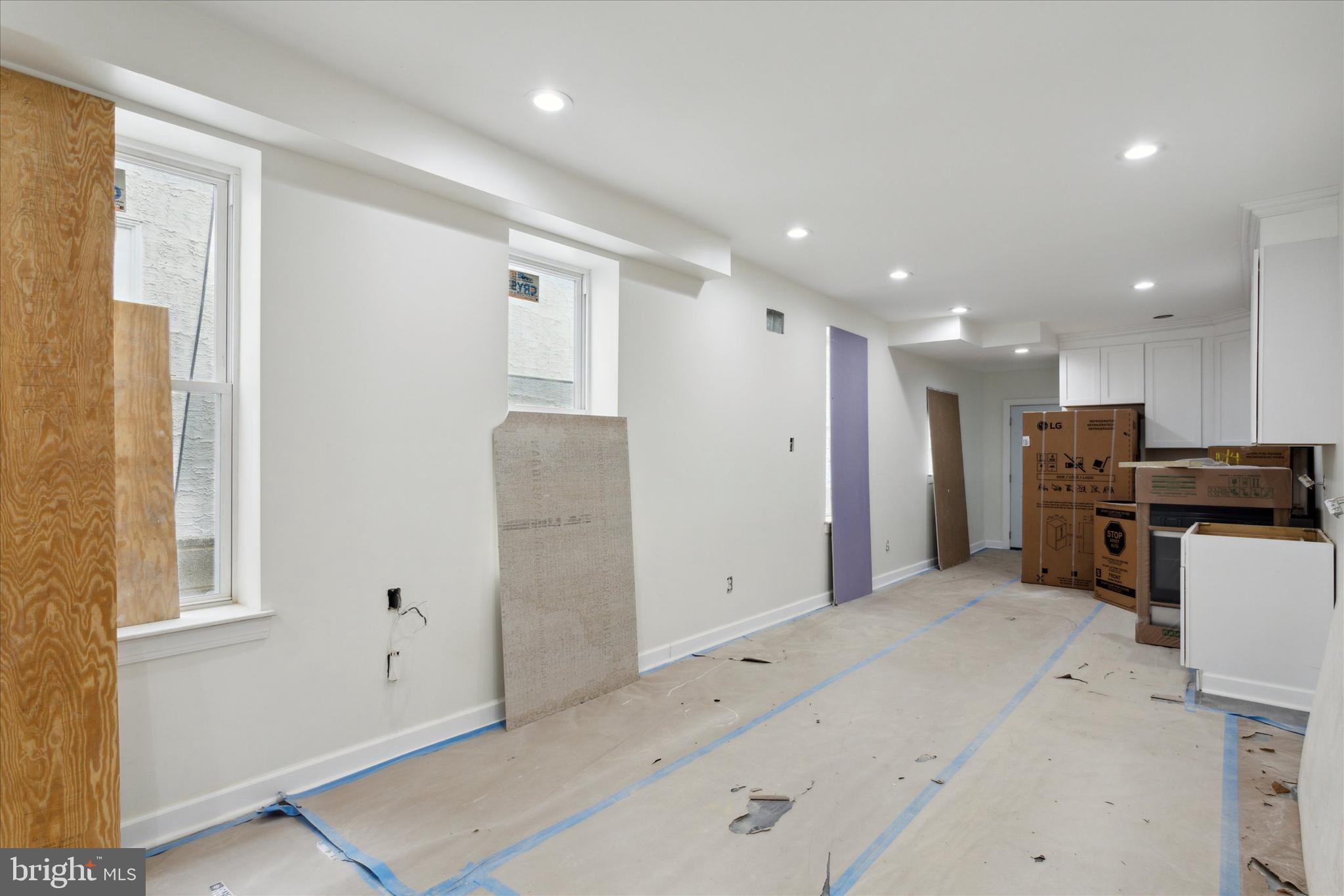 3054 North 15th Street Philadelphia, PA 19132 - Photo 7 of 26 a view of kitchen with refrigerator and windows