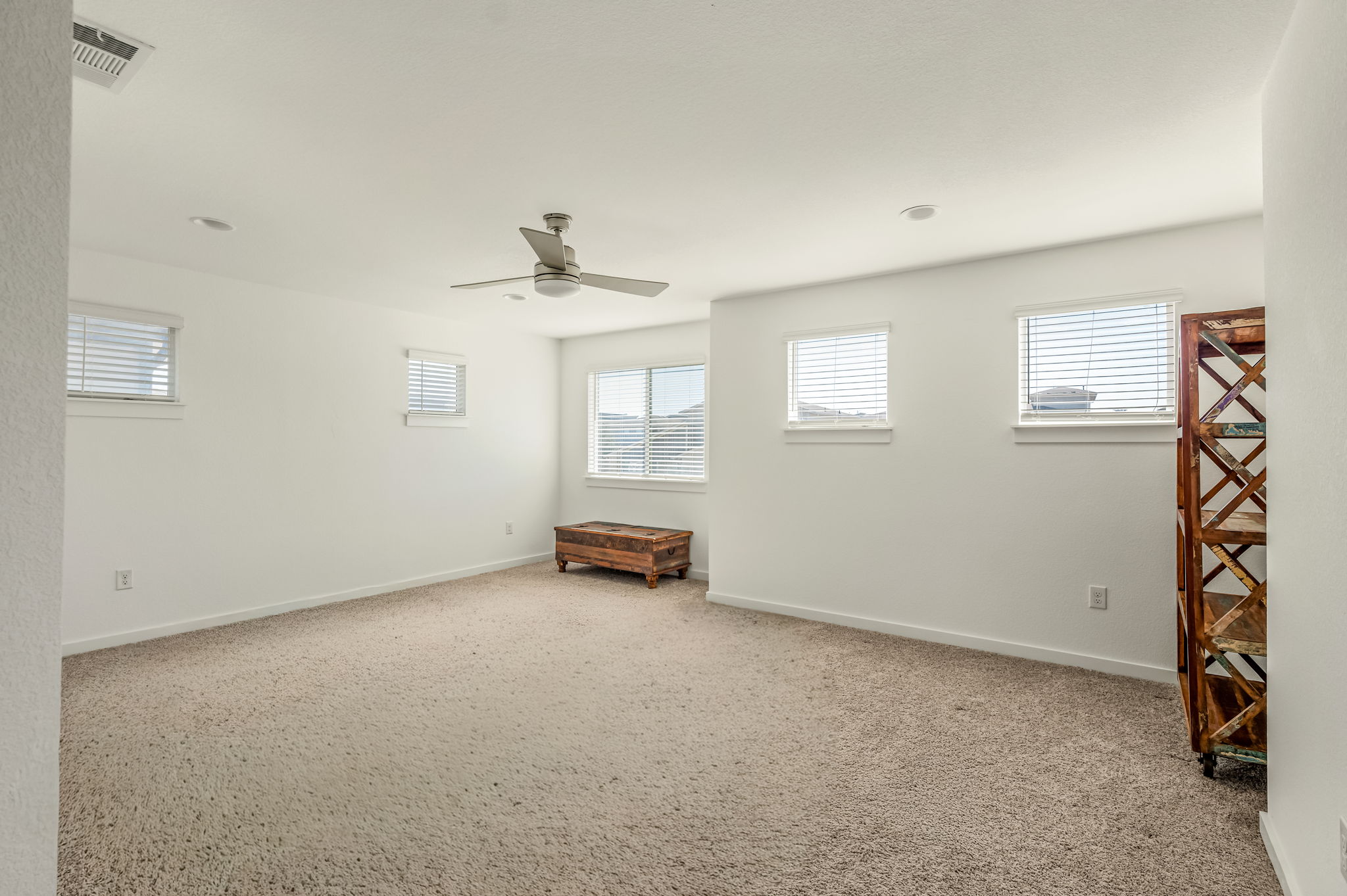 7912 Linnie Lane Austin, TX 78724 - Photo 15 of 38 Spare room with light colored carpet and ceiling fan