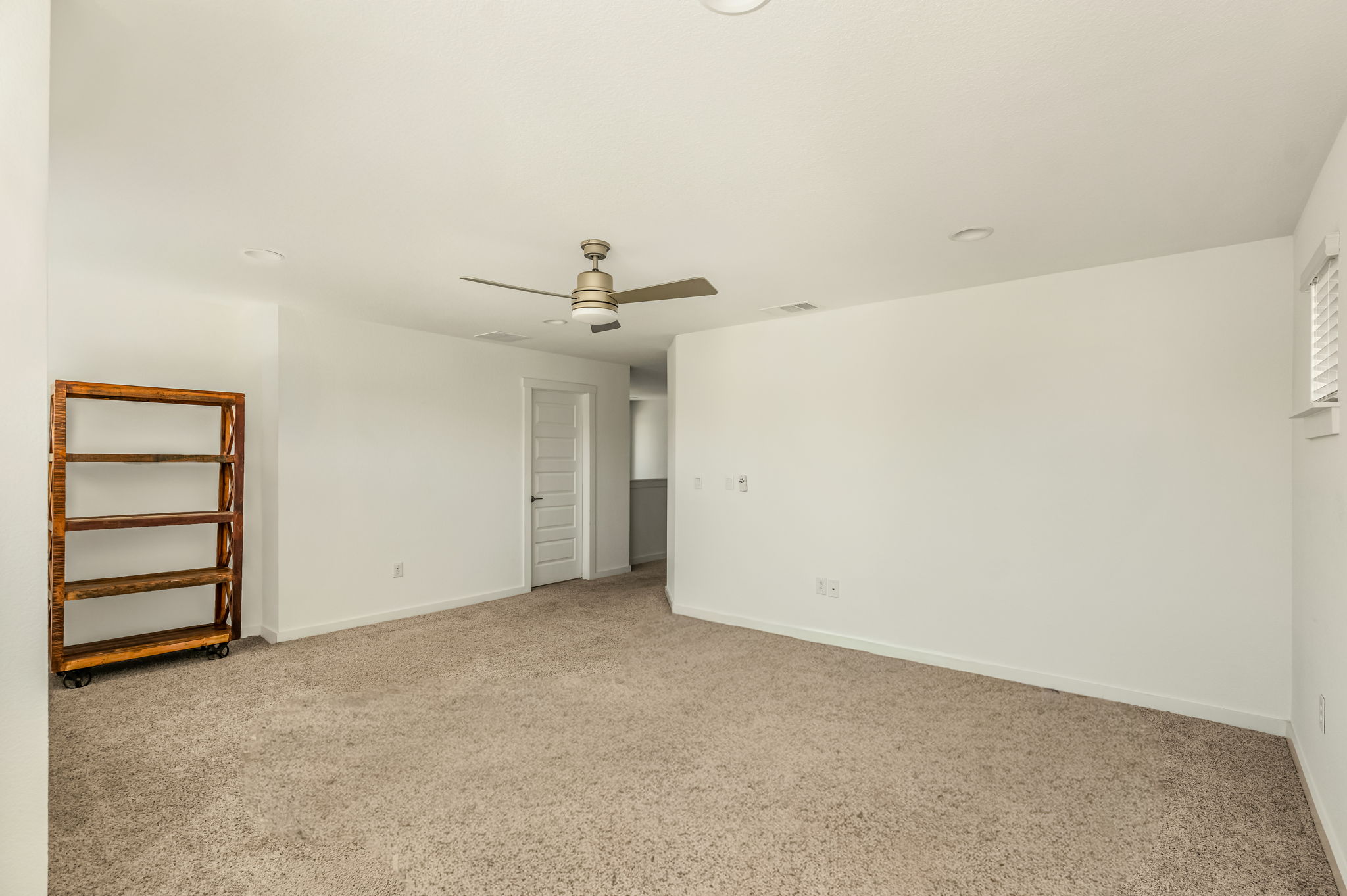 7912 Linnie Lane Austin, TX 78724 - Photo 17 of 38 Unfurnished bedroom with light colored carpet and a ceiling fan