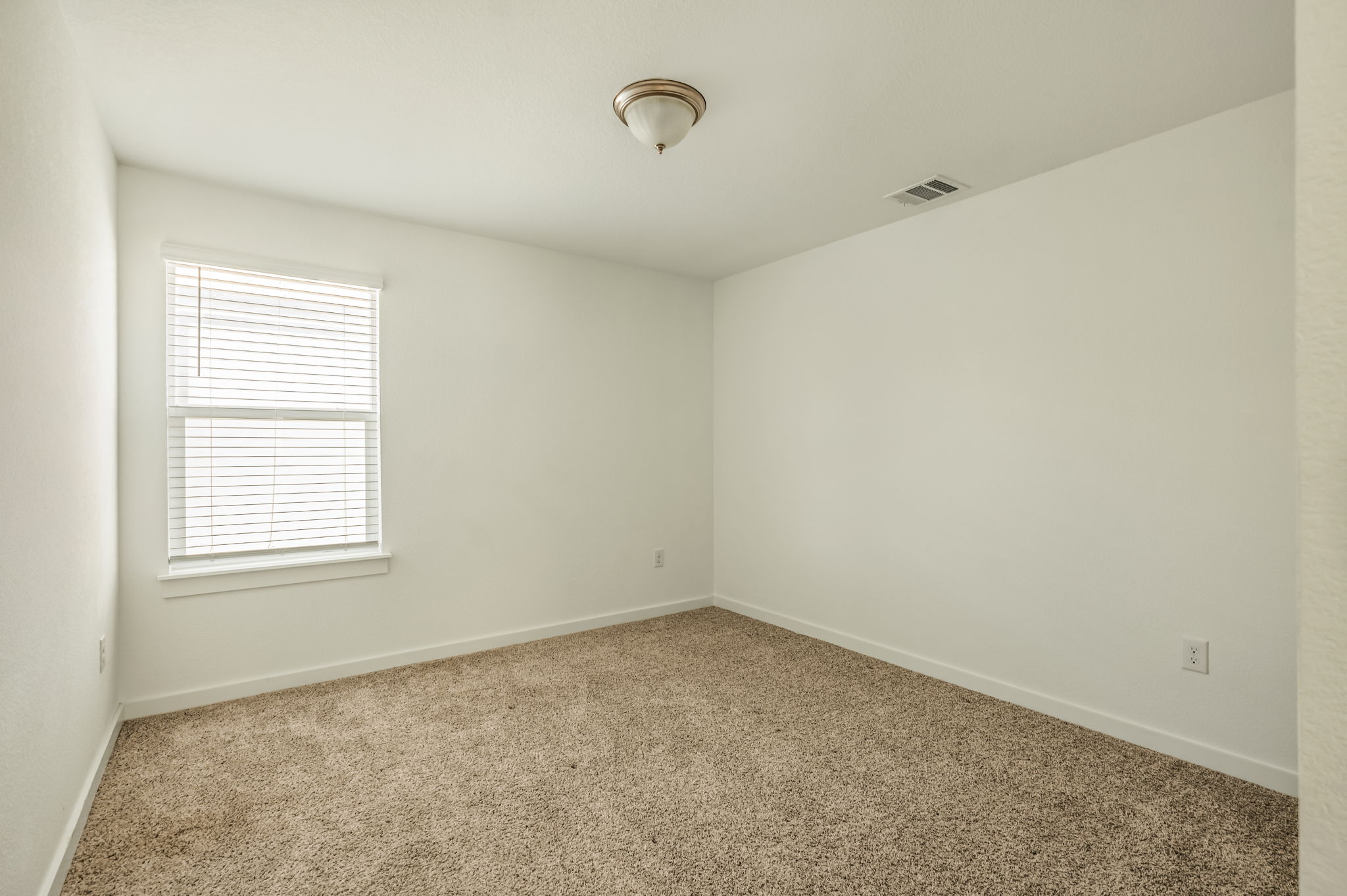 7912 Linnie Lane Austin, TX 78724 - Photo 19 of 38 Empty room featuring baseboards and carpet flooring