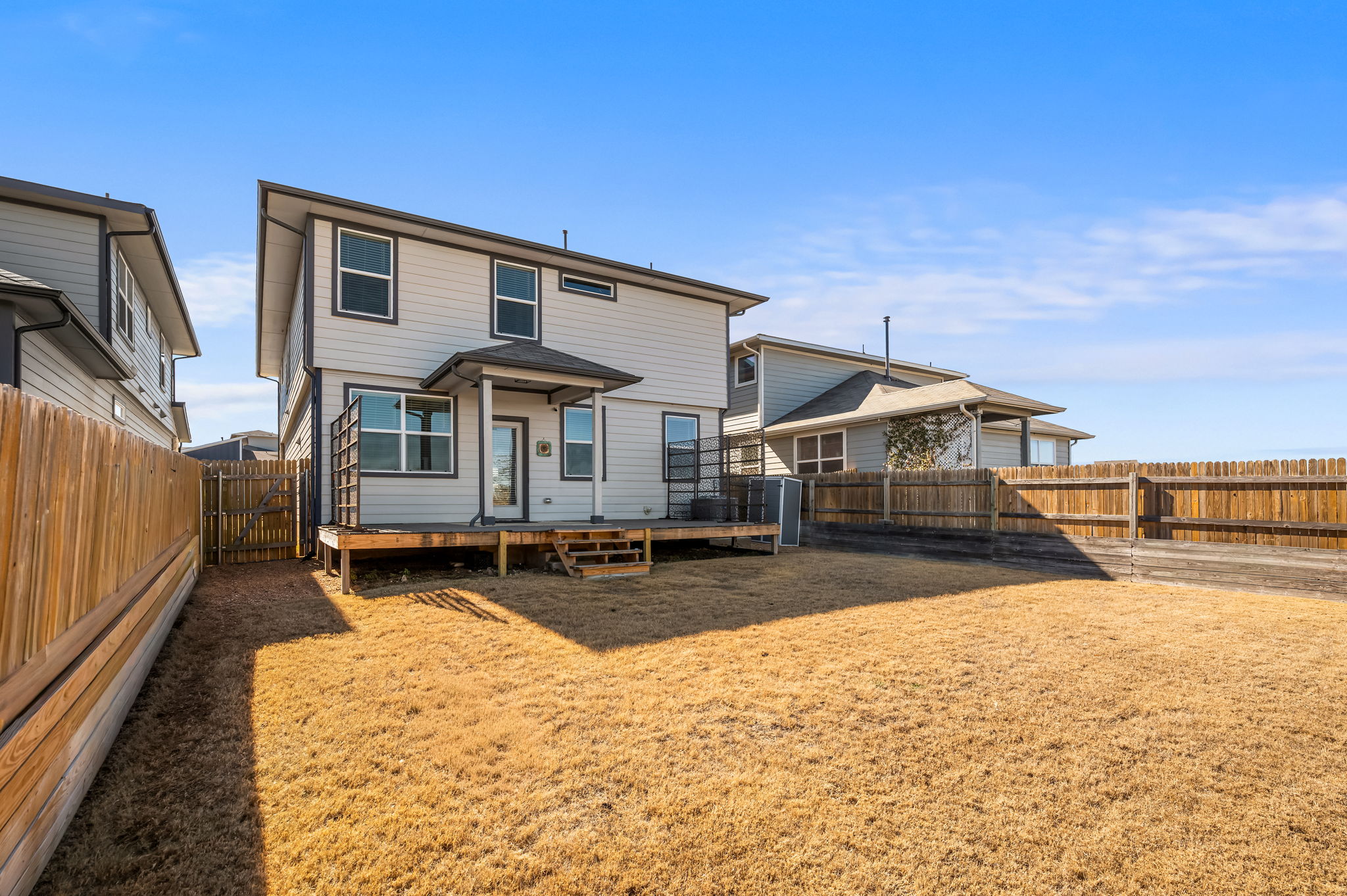 7912 Linnie Lane Austin, TX 78724 - Photo 31 of 38 Rear view of property with a fenced backyard, a gate, and a deck