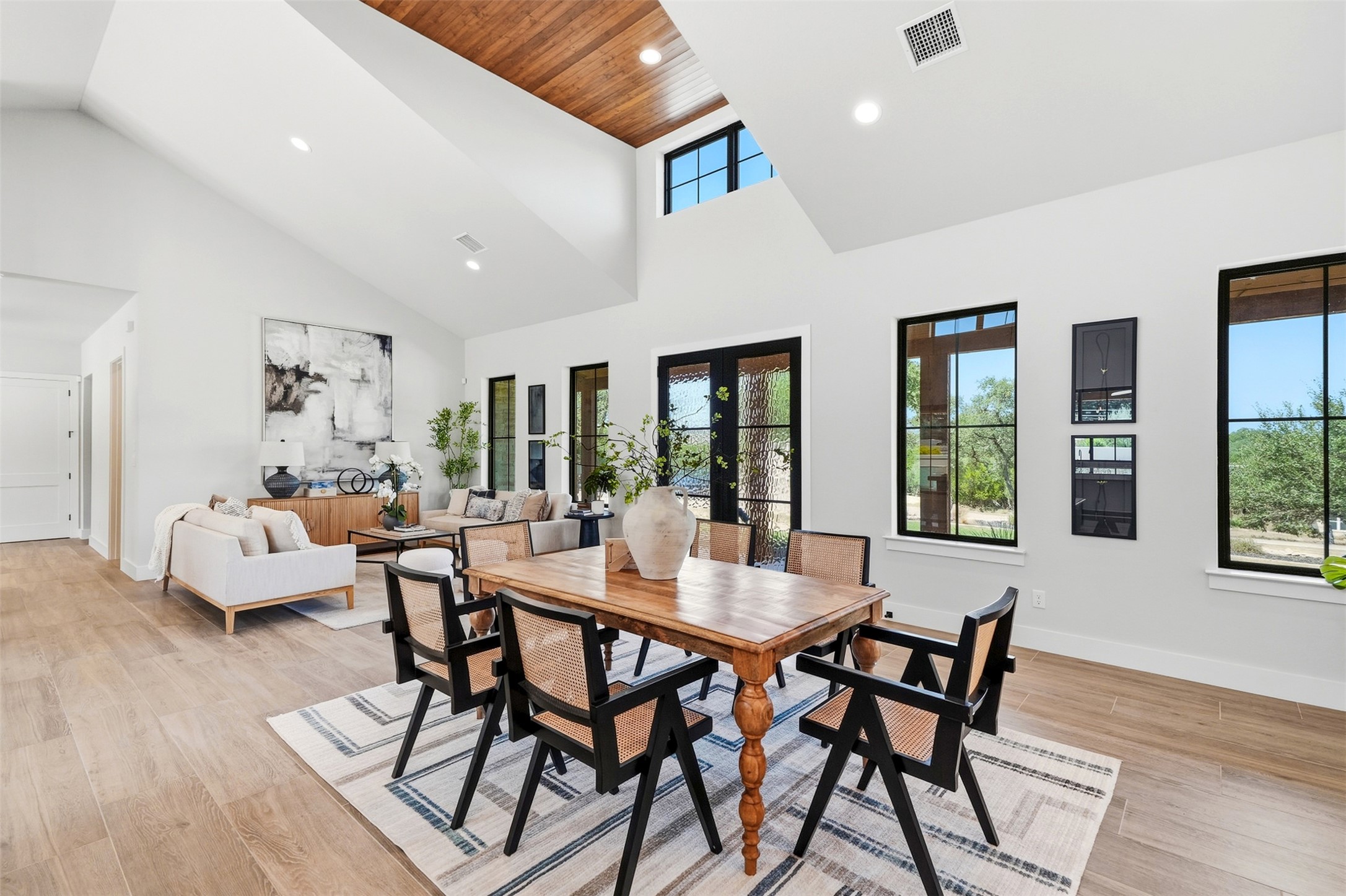 27619 Sunset Loop Garden Ridge, TX 78266 - Photo 3 of 39 Soaring vaulted ceilings and rich wood flooring anchor this sun-drenched open dining space.