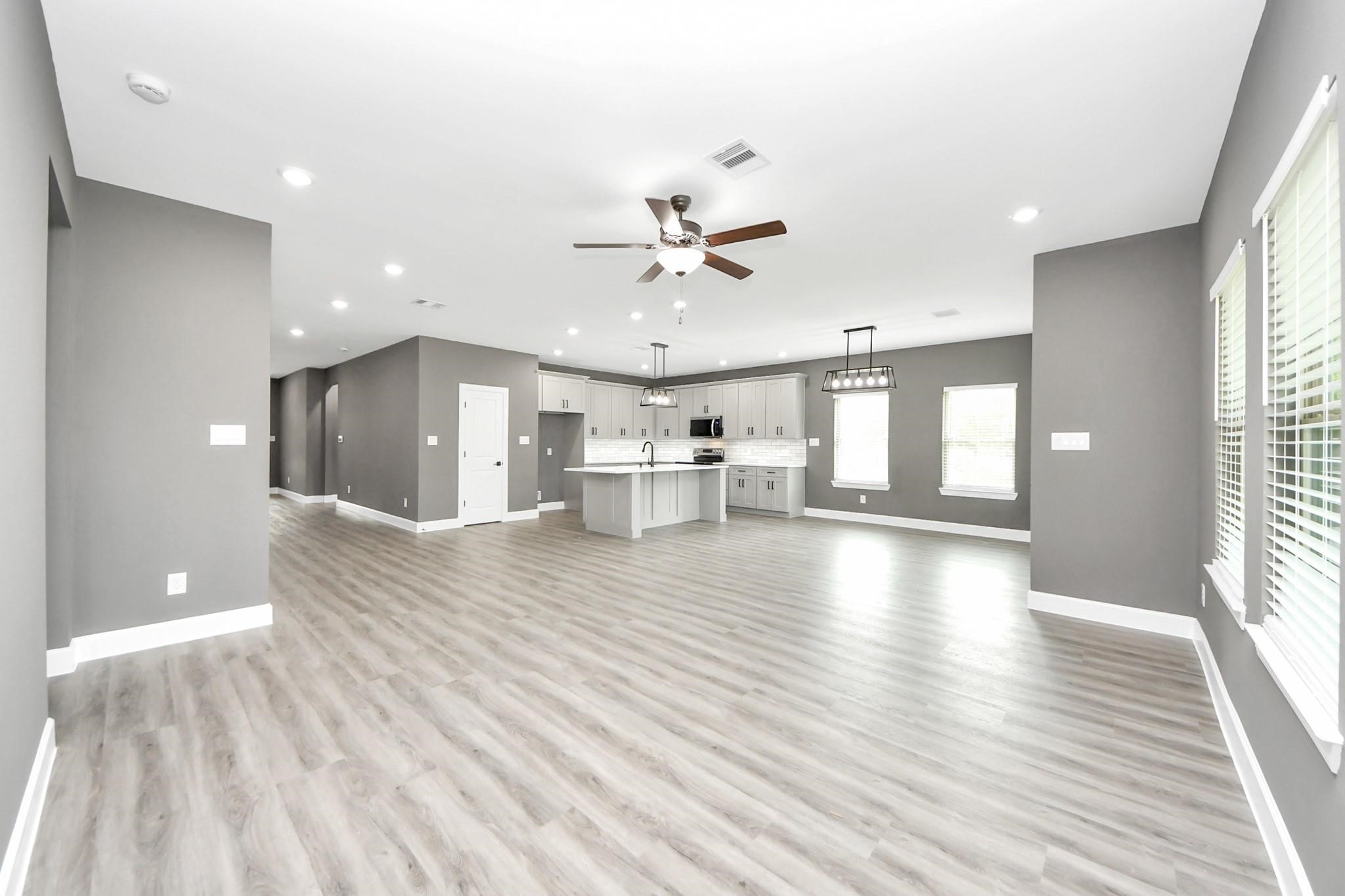 601 Lily Street Prairie View, TX 77484 - Photo 9 of 14 a view of an empty room with wooden floor and a window