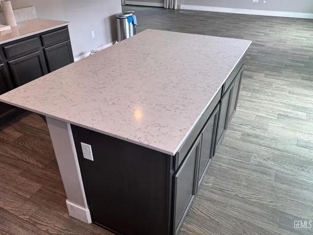 a kitchen with a wooden floor