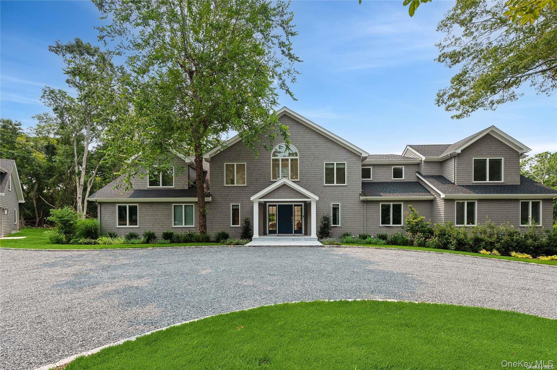 28 Old Meeting House Road Quogue, NY 11959 - Photo 1 of 34 a front view of a house with a garden