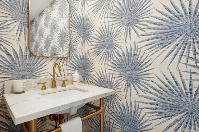 a view of a workspace with a table and chairs