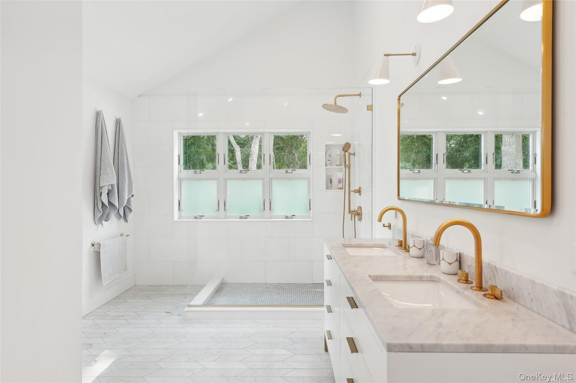 28 Old Meeting House Road Quogue, NY 11959 - Photo 15 of 34 a bathroom with a sink and a mirror