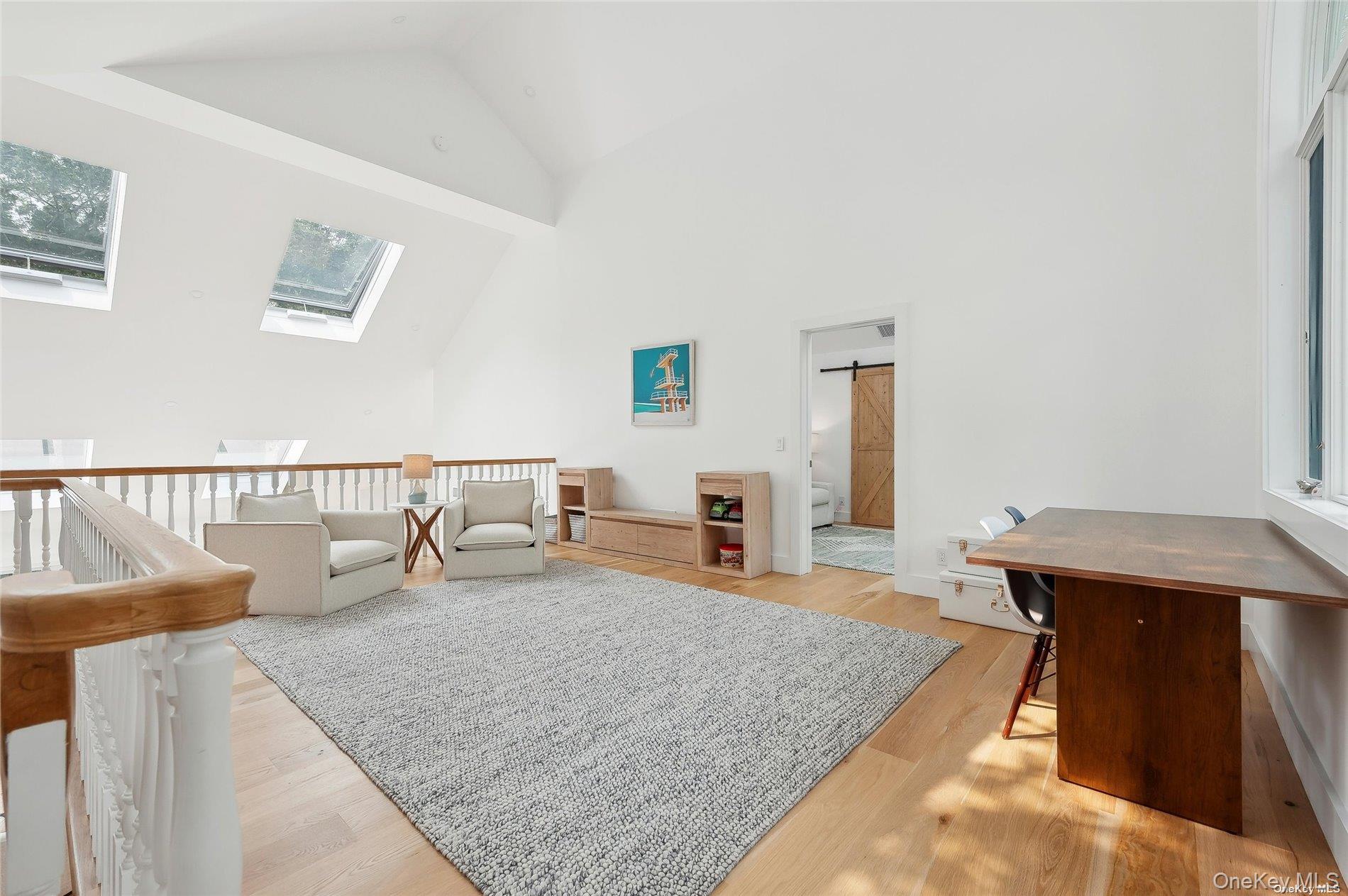 28 Old Meeting House Road Quogue, NY 11959 - Photo 19 of 34 a living room with furniture and wooden floor