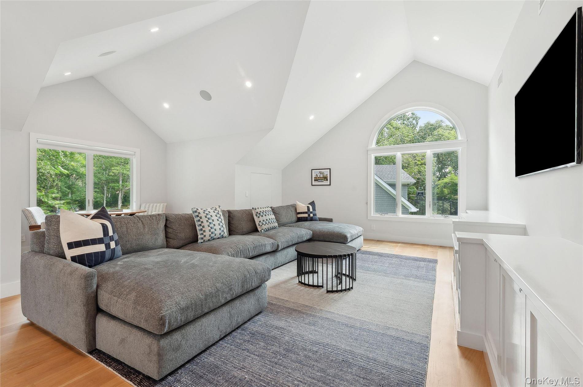 28 Old Meeting House Road Quogue, NY 11959 - Photo 20 of 34 a living room with furniture and a flat screen tv
