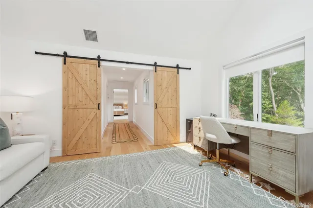 a bed room with a bed and a table