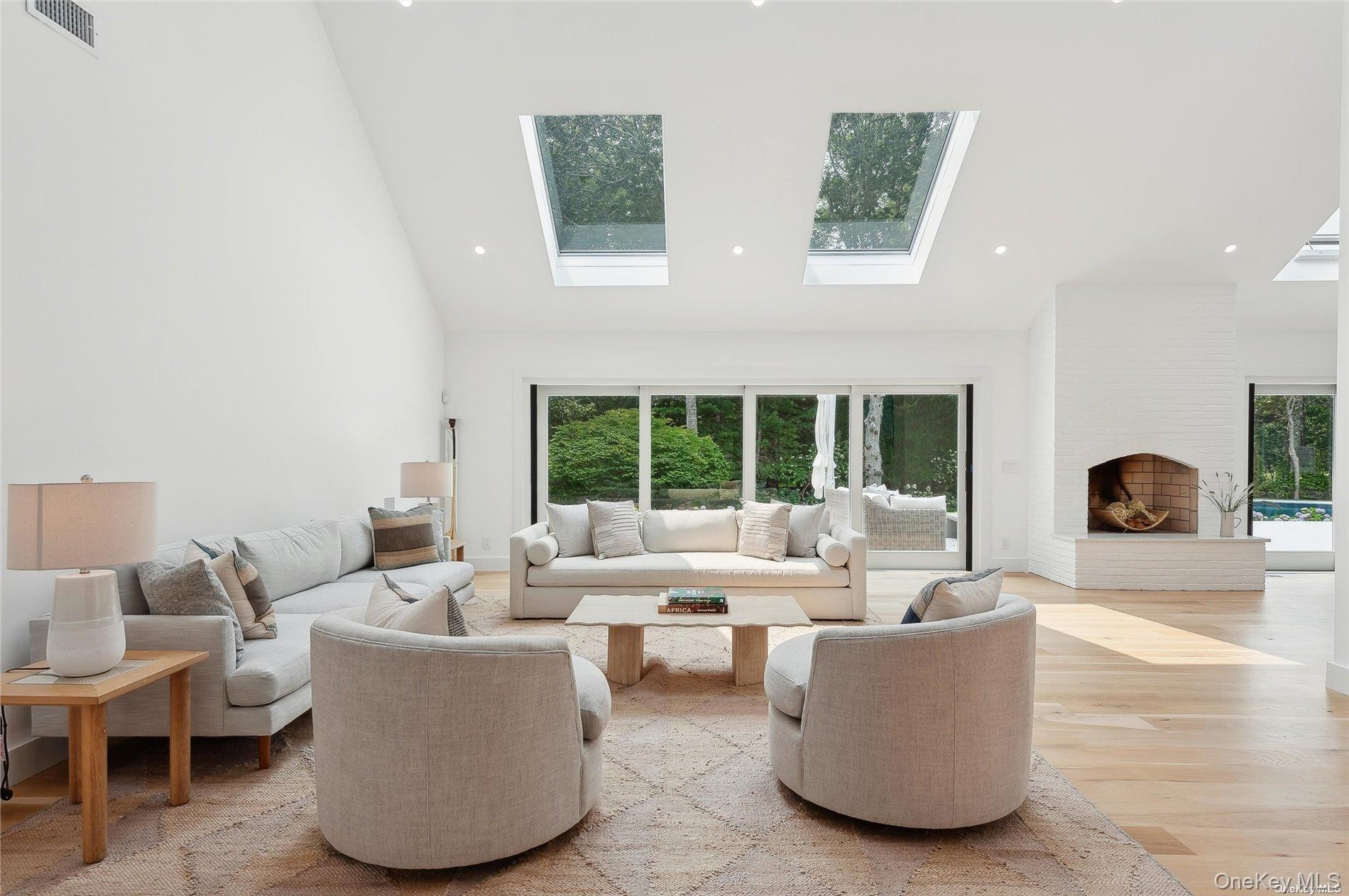 28 Old Meeting House Road Quogue, NY 11959 - Photo 6 of 34 a living room with furniture and a large window