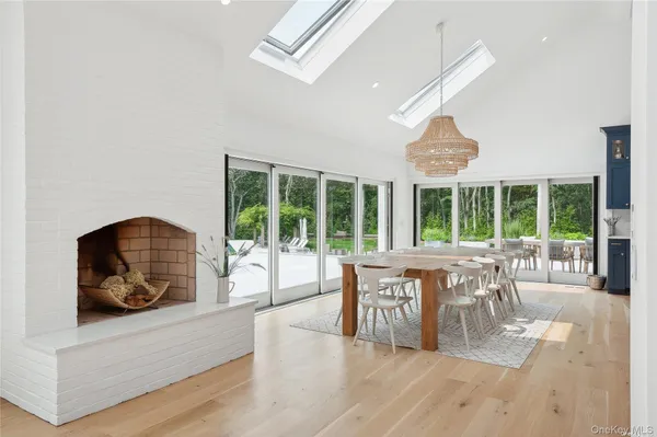 a living room with furniture and large windows
