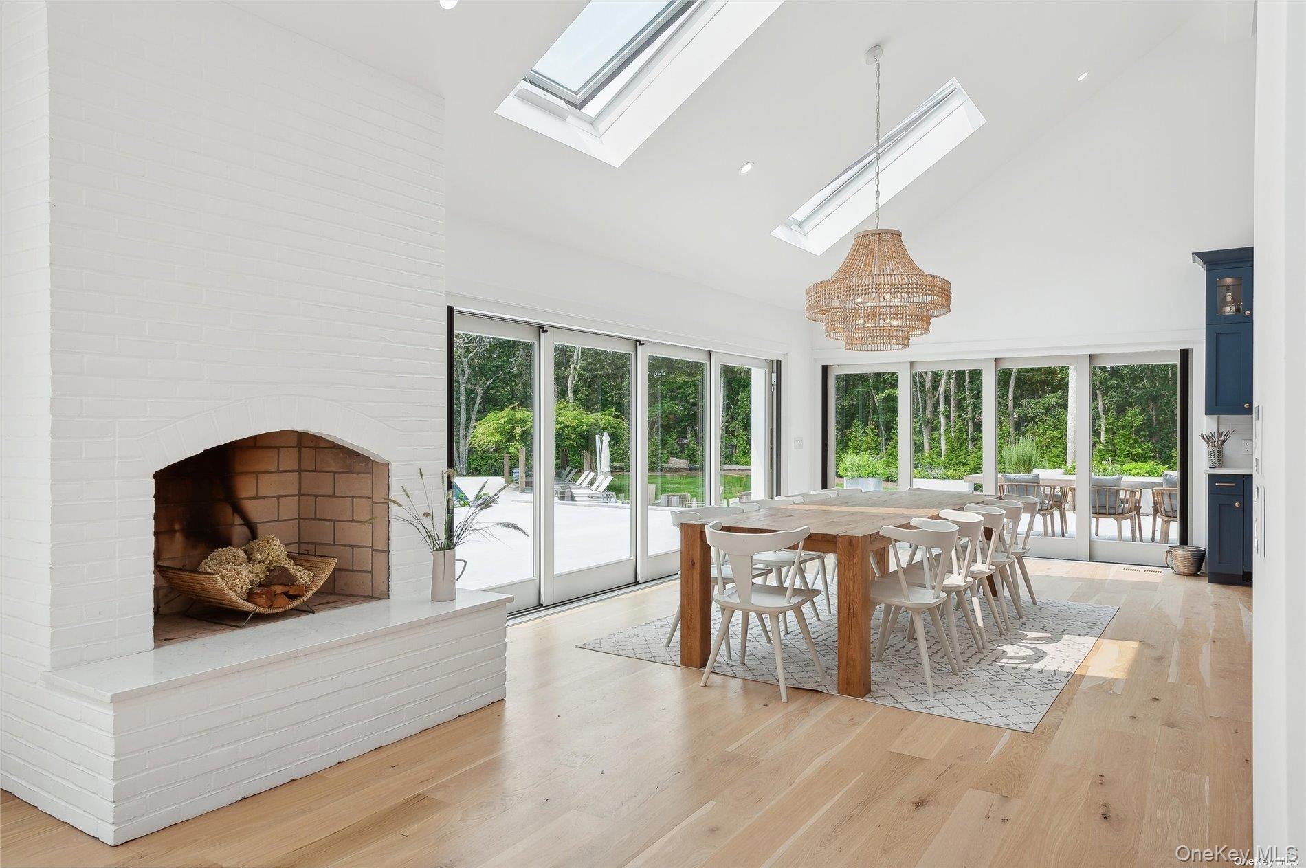 28 Old Meeting House Road Quogue, NY 11959 - Photo 7 of 34 a living room with furniture and large windows