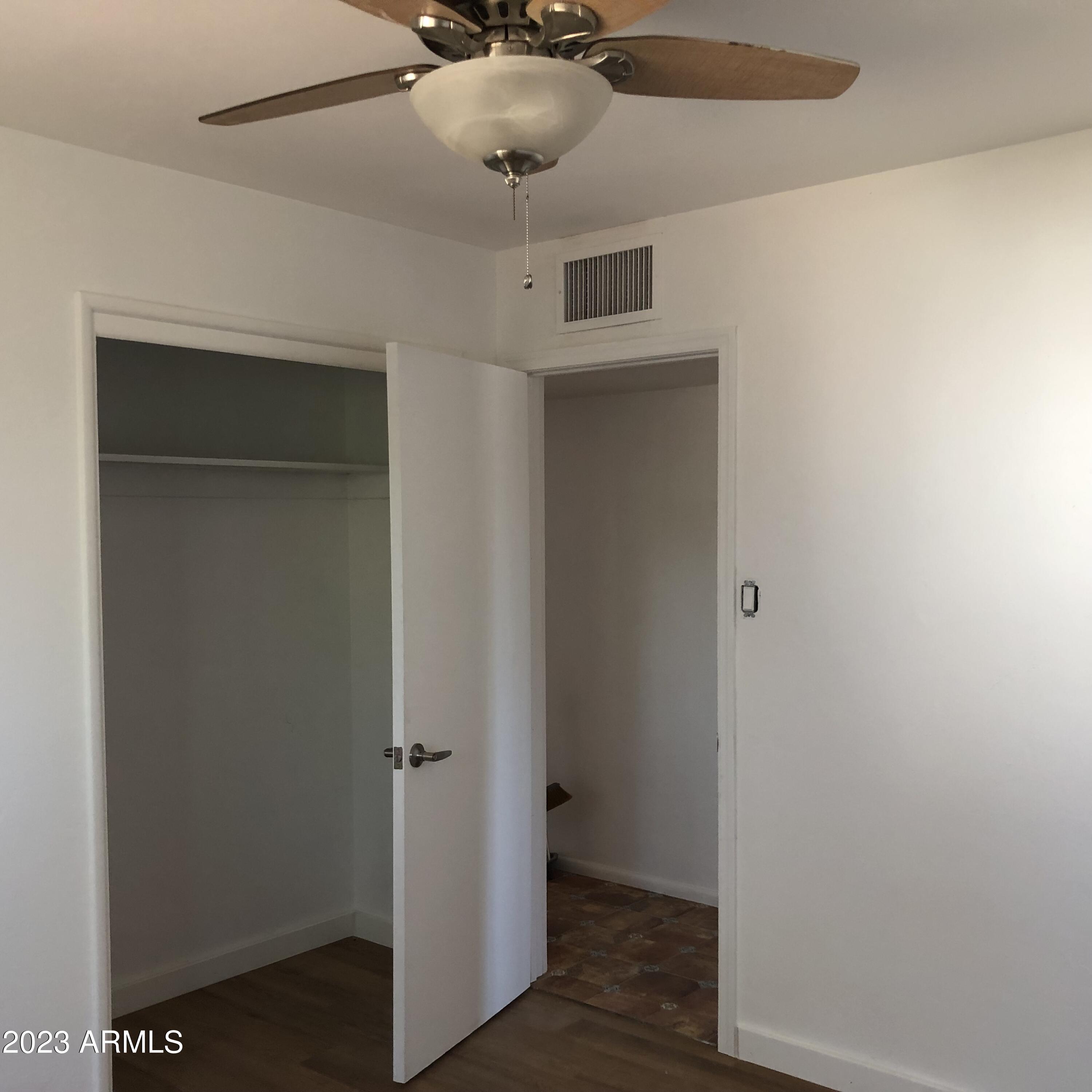 705 West 16th Street Tempe, AZ 85281 - Photo 12 of 24 a view of a hallway with a wooden cabinets
