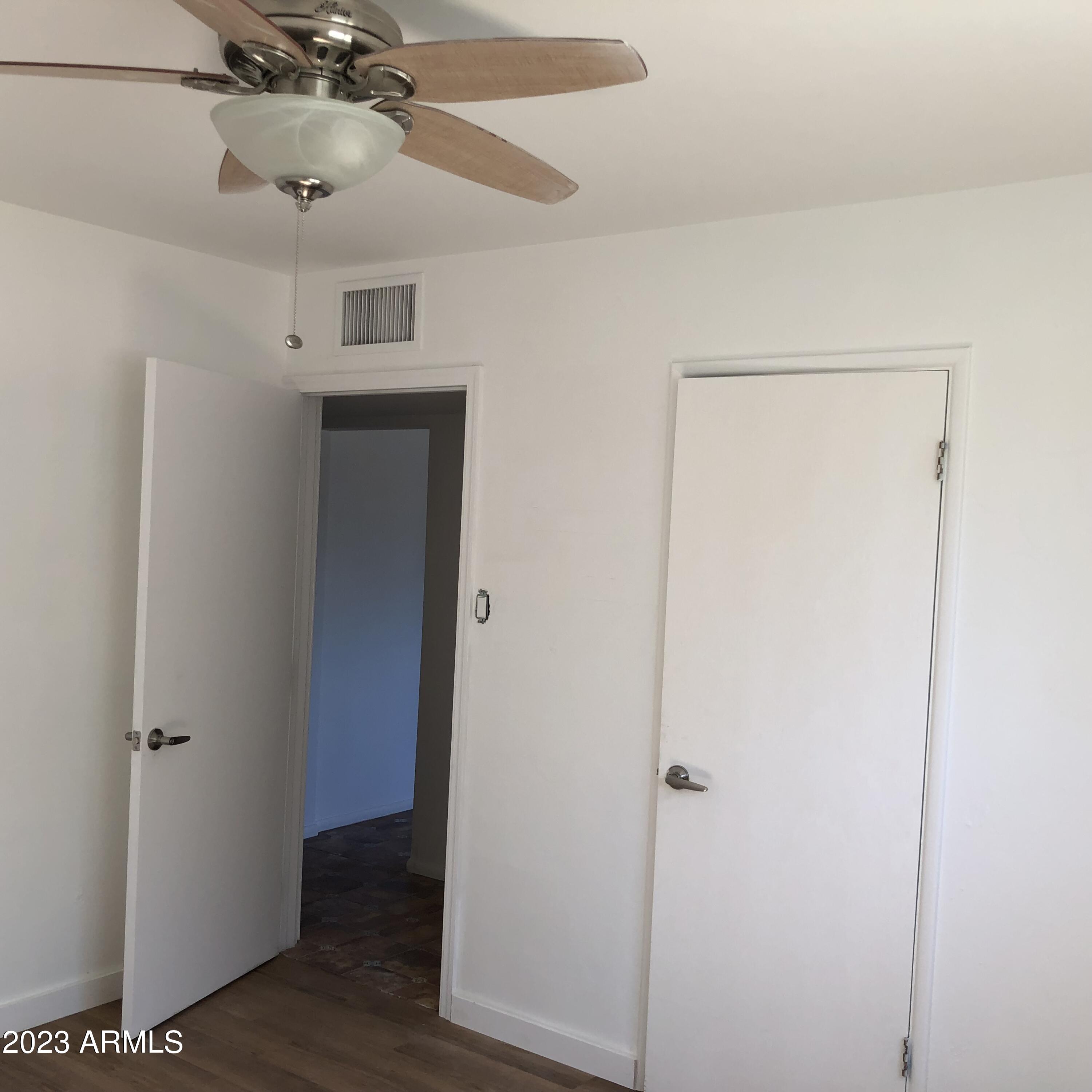 705 West 16th Street Tempe, AZ 85281 - Photo 13 of 24 a view of a hallway with a wooden floor