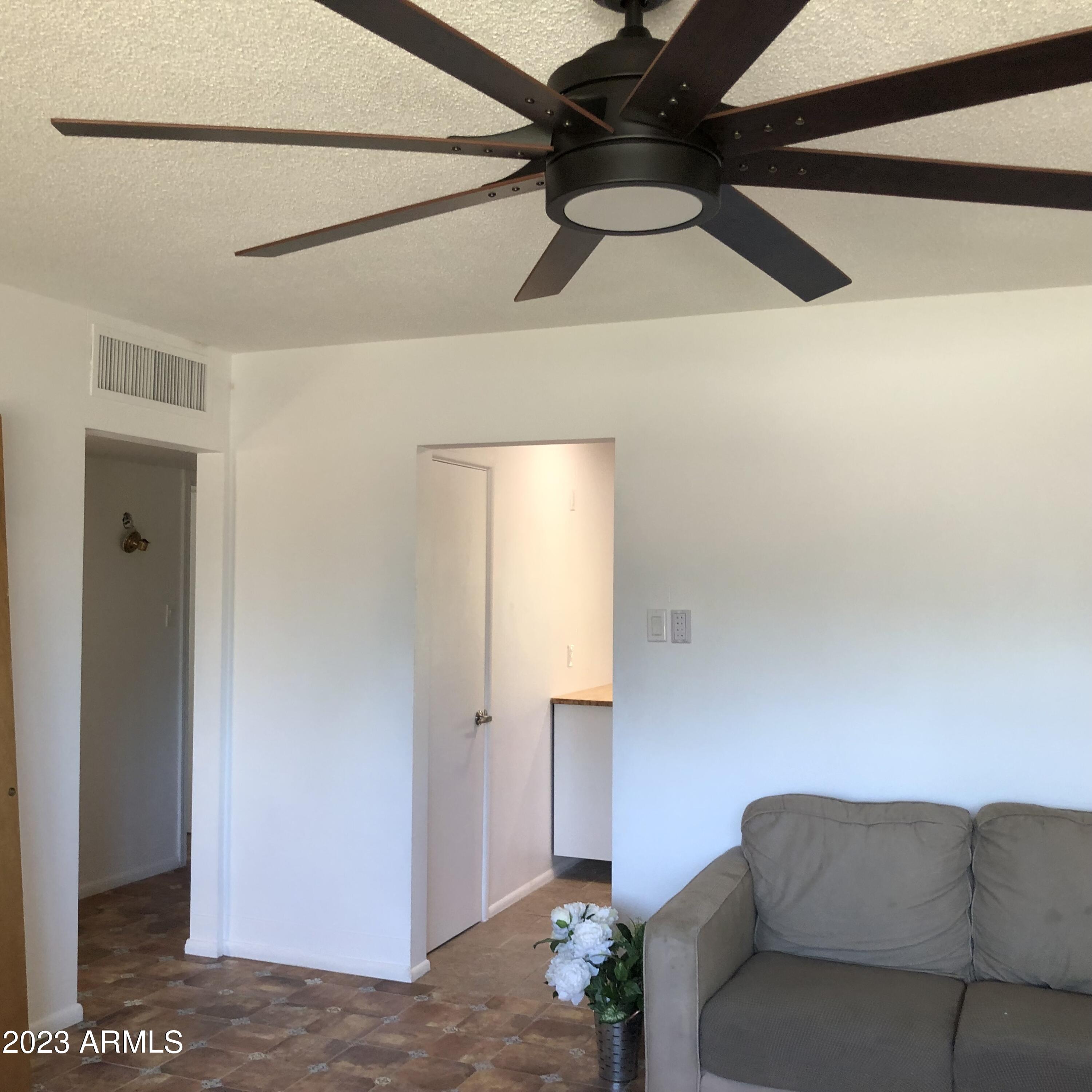 705 West 16th Street Tempe, AZ 85281 - Photo 17 of 24 a living room with a couch and a ceiling fan