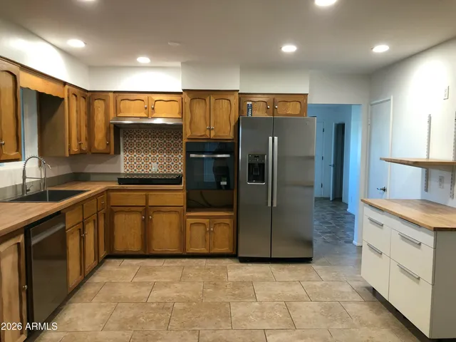 a bathroom with a sink a toilet and bathtub