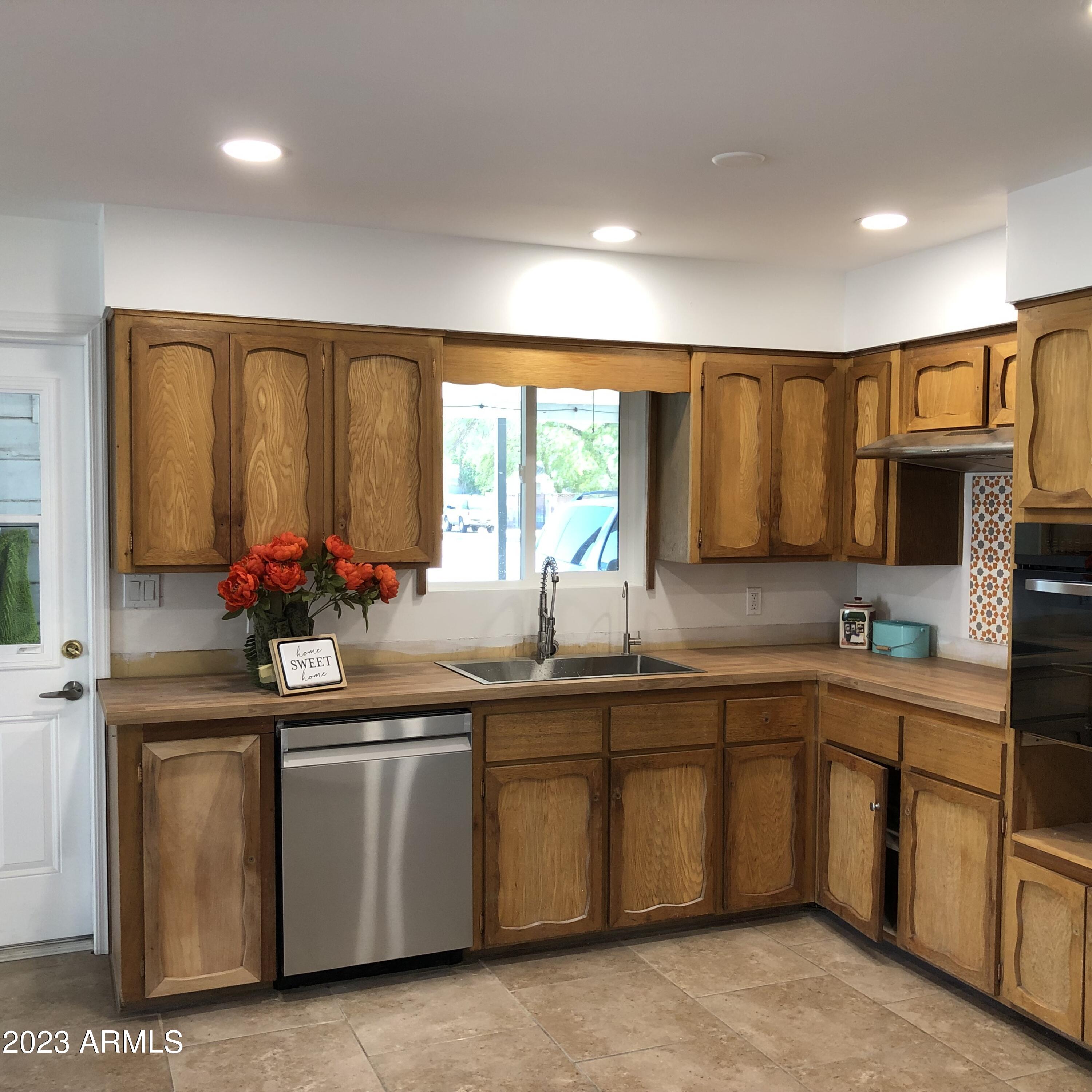 705 West 16th Street Tempe, AZ 85281 - Photo 4 of 24 a kitchen with sink cabinets and window