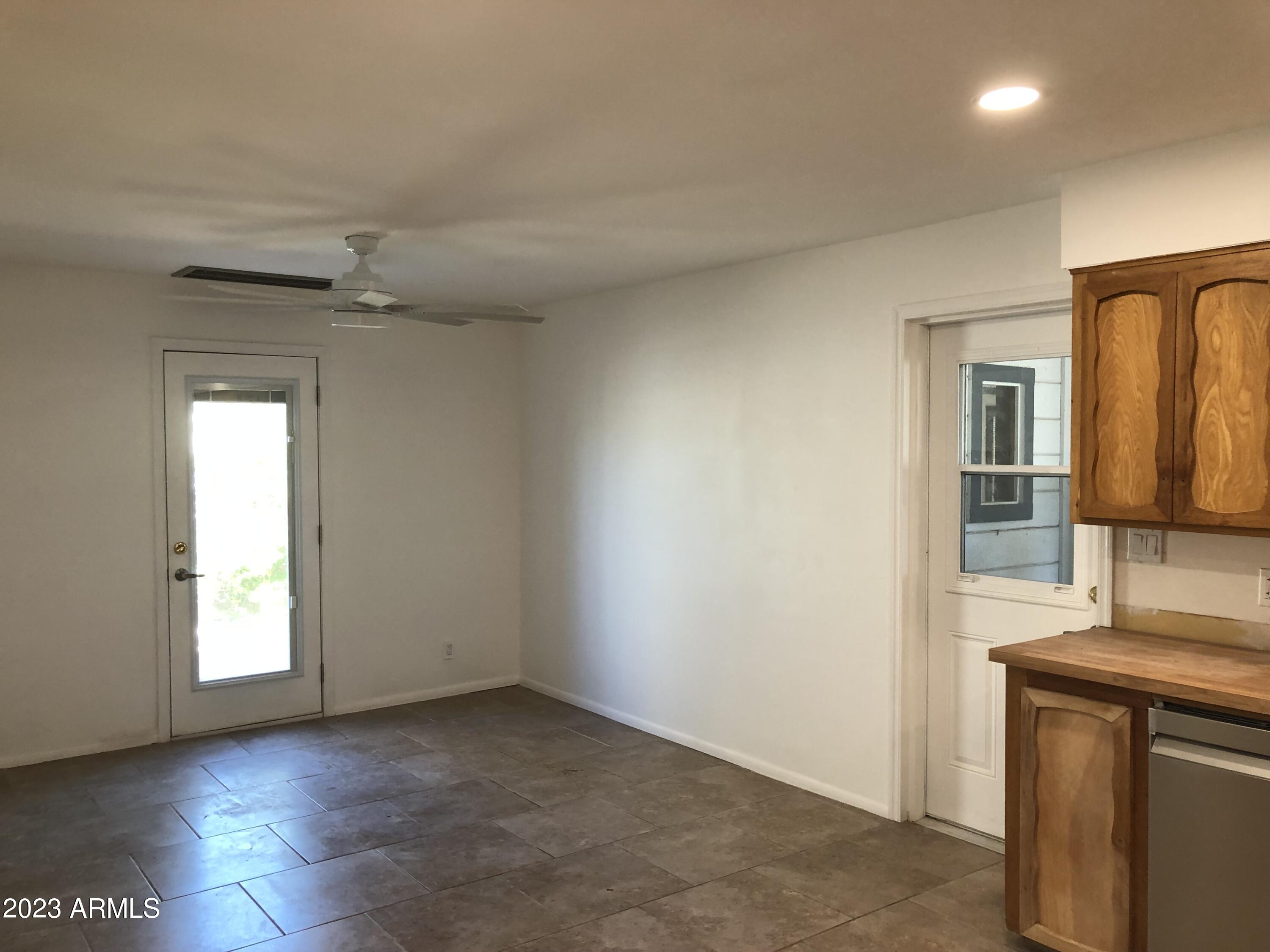705 West 16th Street Tempe, AZ 85281 - Photo 5 of 24 an empty room with windows and cabinet