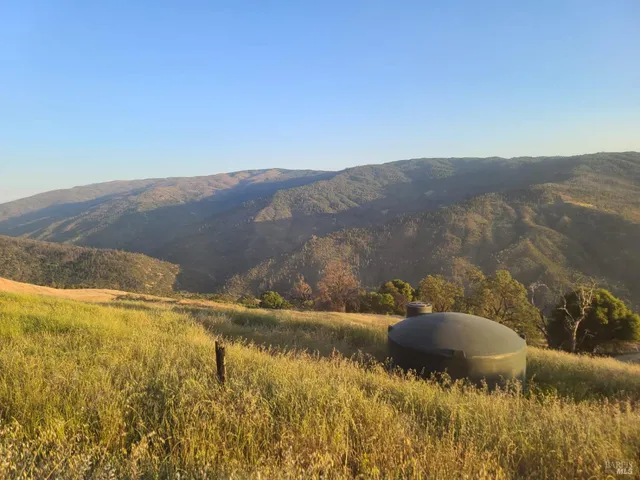 a view of an ocean and mountain
