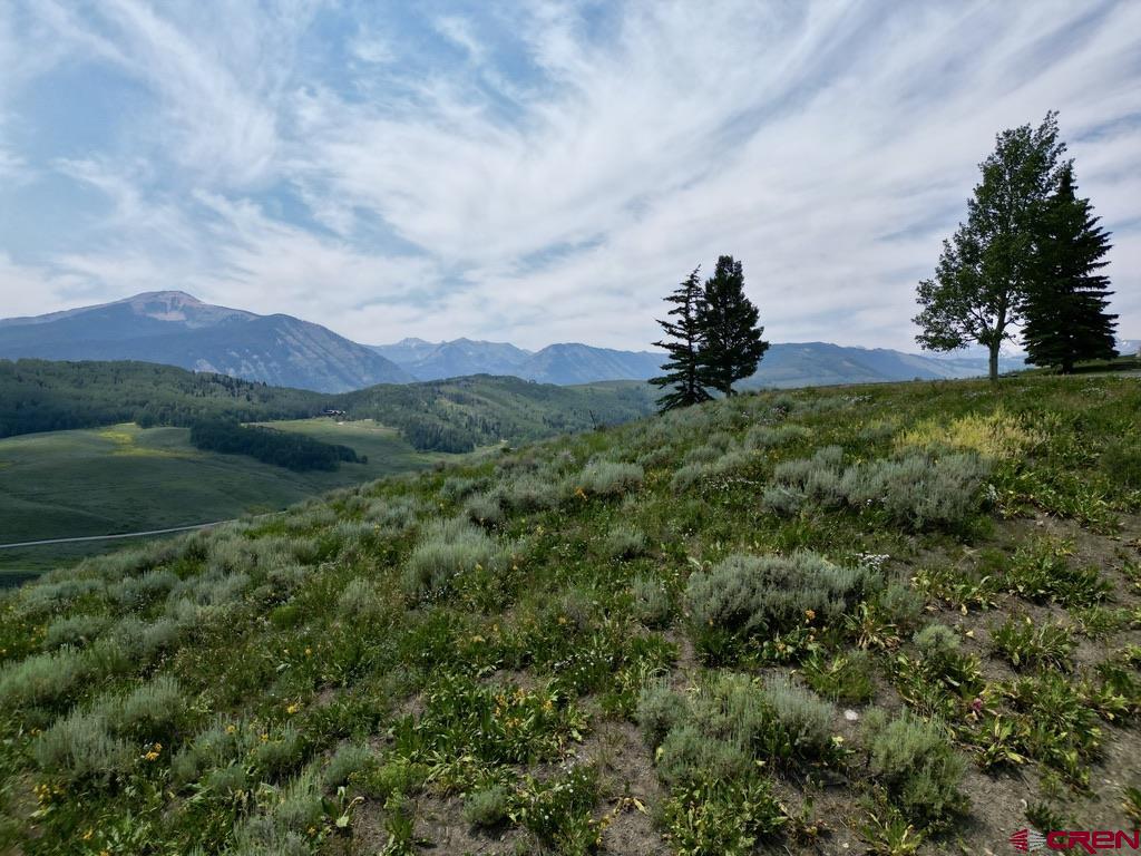19 Buttercup Lane Crested Butte, CO 81225 - Photo 7 of 17 a view of a lake in front of a building
