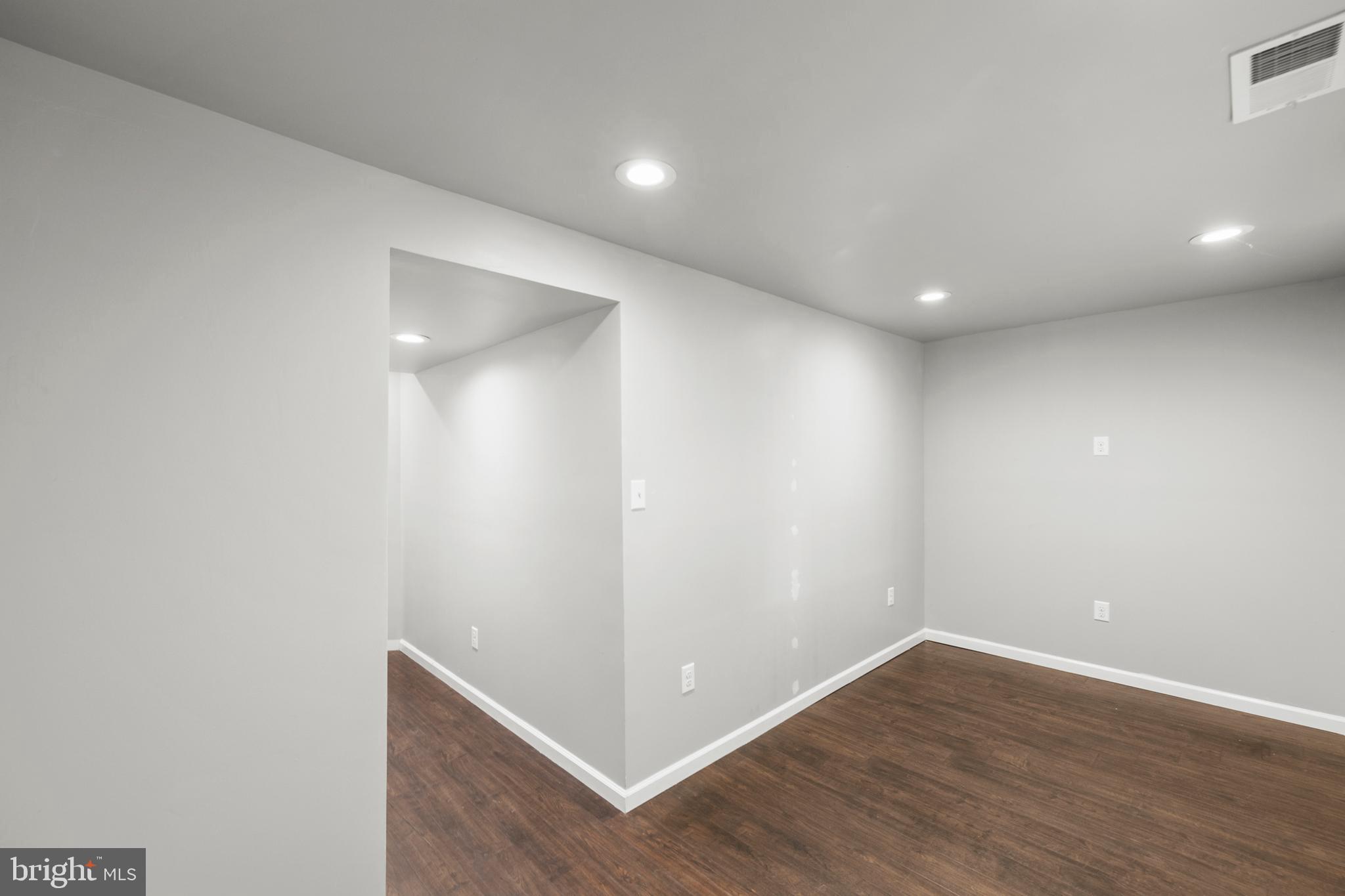 113 Reign Way Winchester, VA 22603 - Photo 27 of 35 a view of an empty room with wooden floor