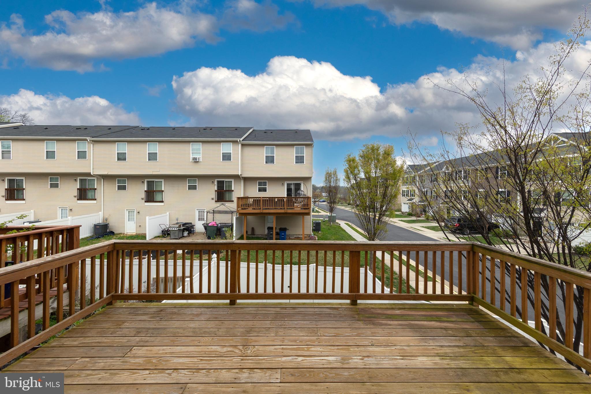 113 Reign Way Winchester, VA 22603 - Photo 32 of 35 a view of a balcony with wooden fence