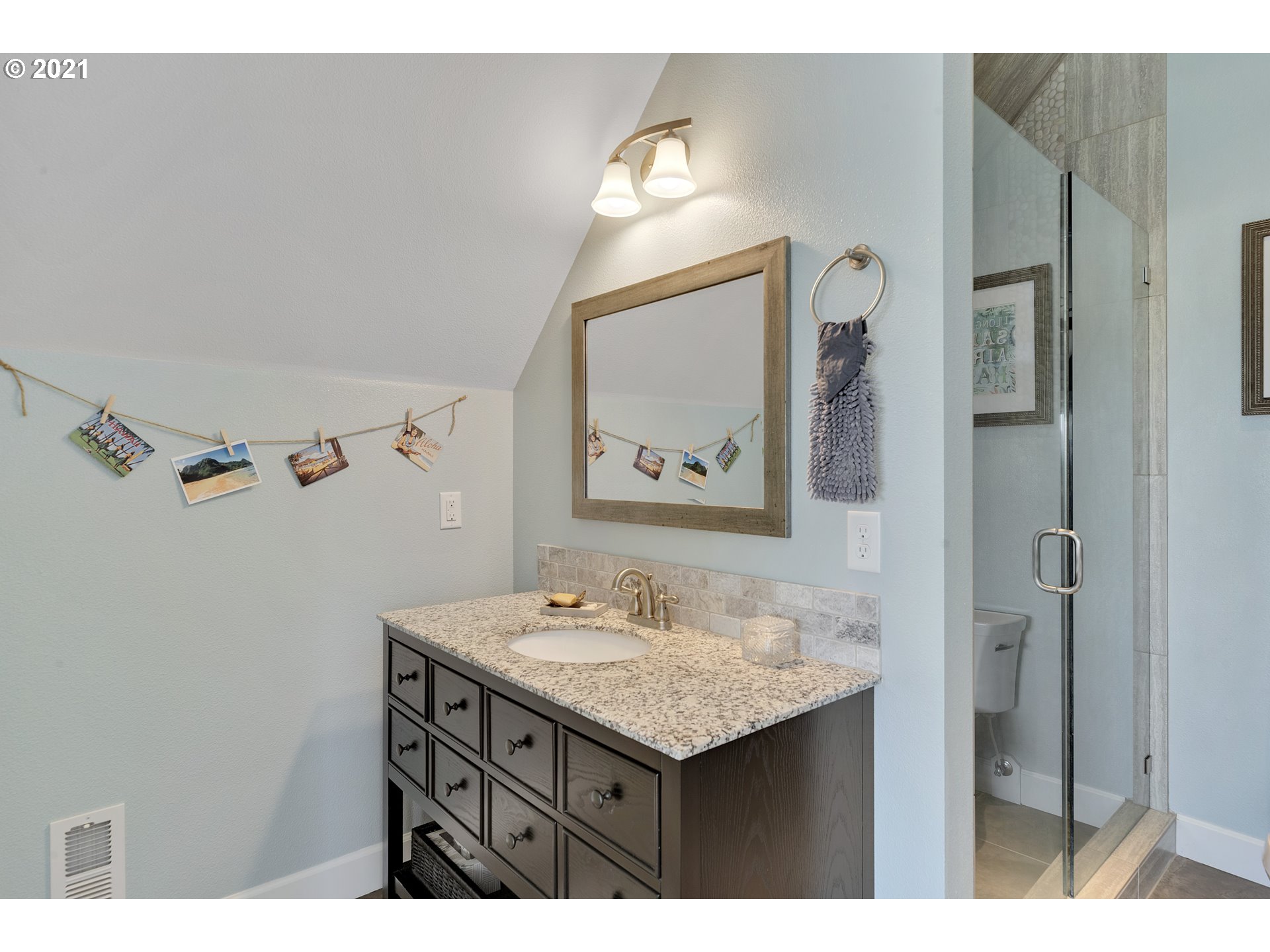 32991 South Kropf Road Molalla, OR 97038 - Photo 16 of 32 a bathroom with a sink vanity and a mirror