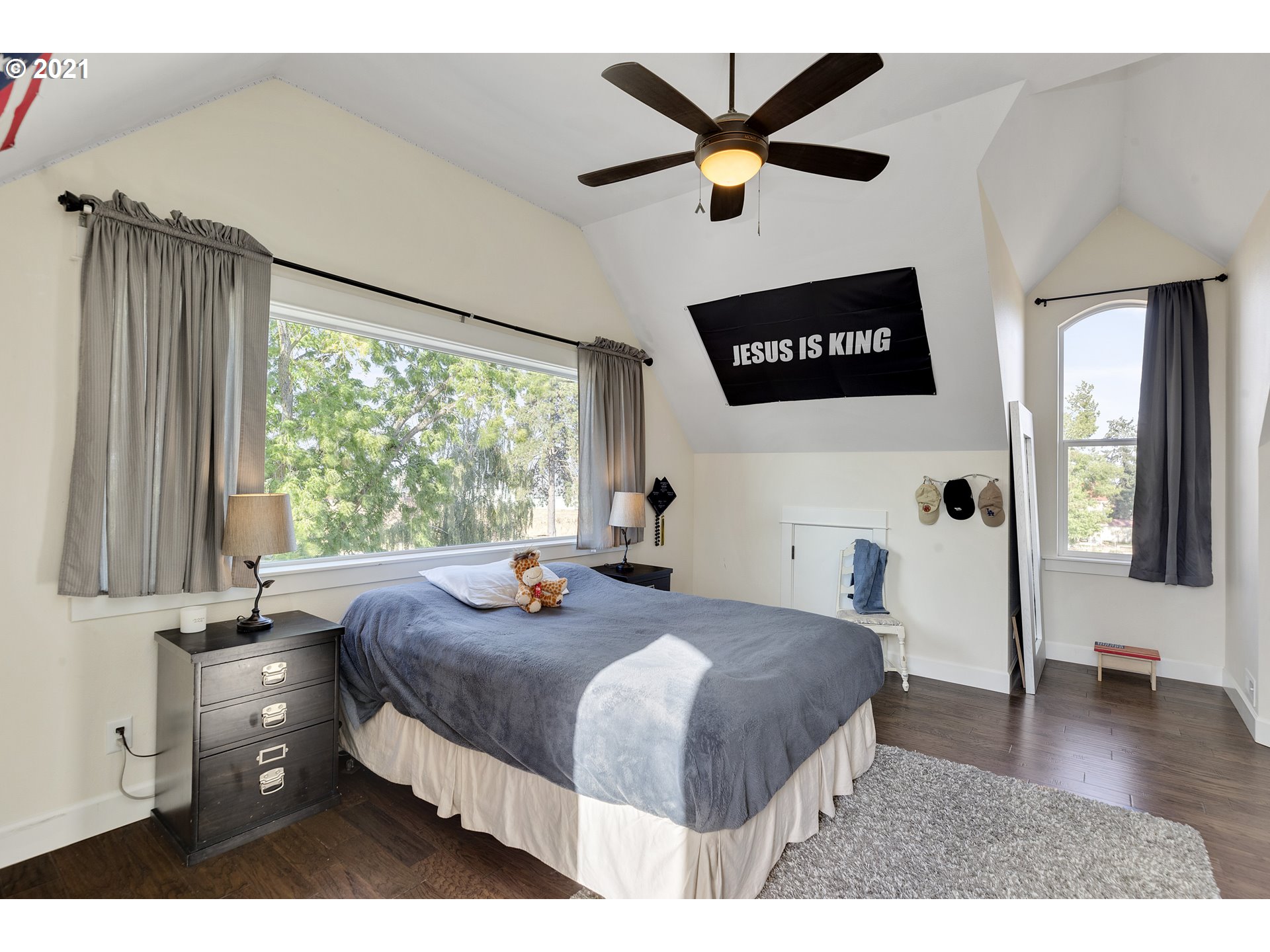32991 South Kropf Road Molalla, OR 97038 - Photo 21 of 32 a bedroom with a bed a dresser and a large window