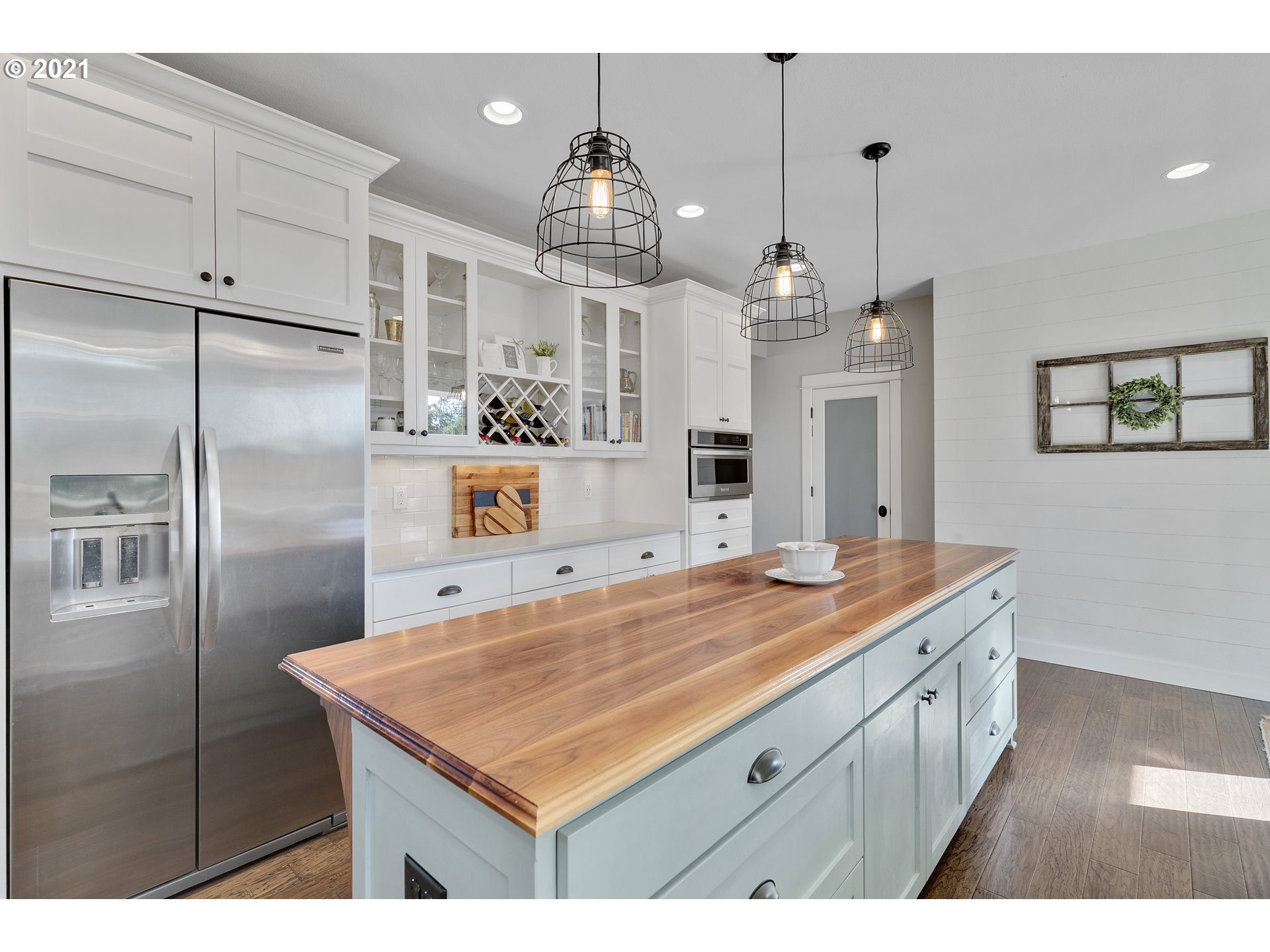 32991 South Kropf Road Molalla, OR 97038 - Photo 10 of 32 a kitchen with kitchen island granite countertop a sink refrigerator and cabinets