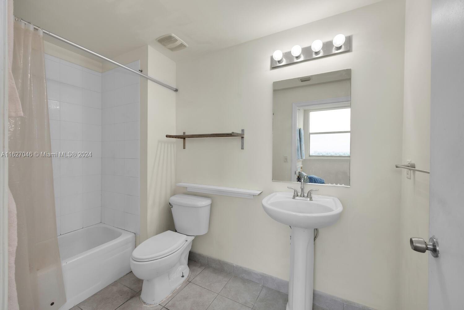 West Flagler Miami, FL 33125 - Photo 18 of 29 a bathroom with a sink toilet and shower