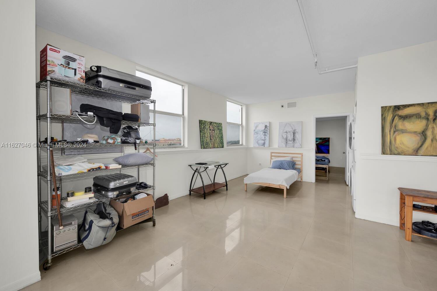 West Flagler Miami, FL 33125 - Photo 19 of 29 a view of living room with furniture and a flat screen tv