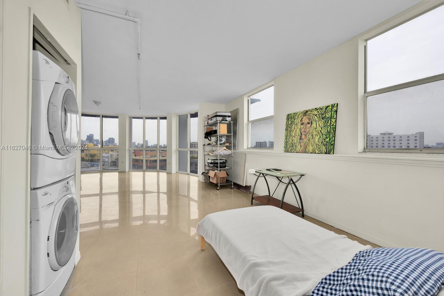 West Flagler Miami, FL 33125 - Photo 20 of 29 a bedroom with furniture and a large window