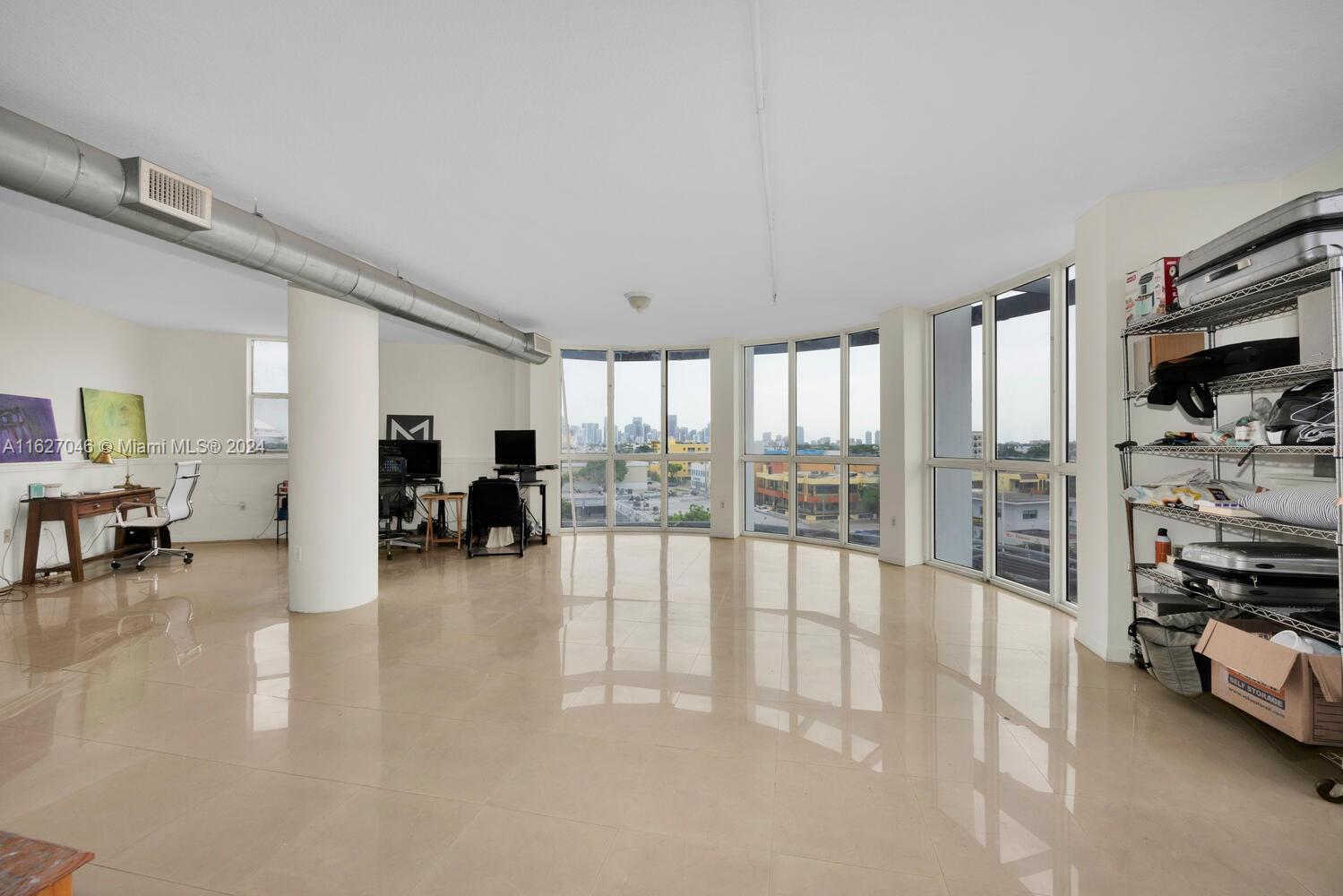 West Flagler Miami, FL 33125 - Photo 23 of 29 a living room with furniture and a flat screen tv