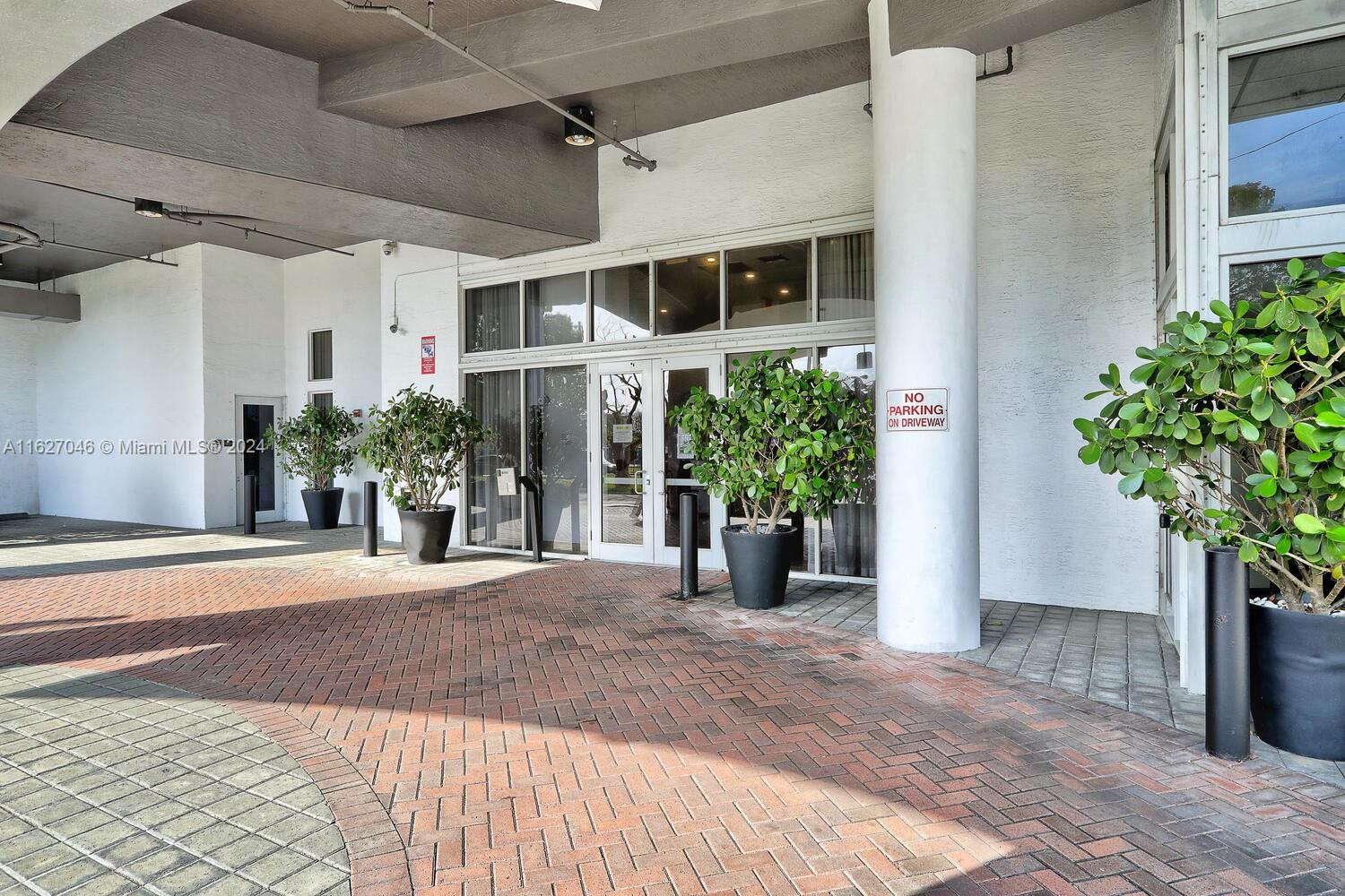 West Flagler Miami, FL 33125 - Photo 25 of 29 a view of a house with a yard and potted plants