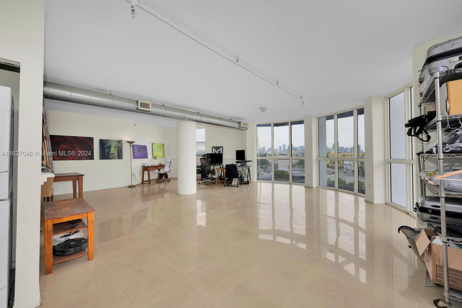 West Flagler Miami, FL 33125 - Photo 6 of 29 a living room with furniture and a flat screen tv