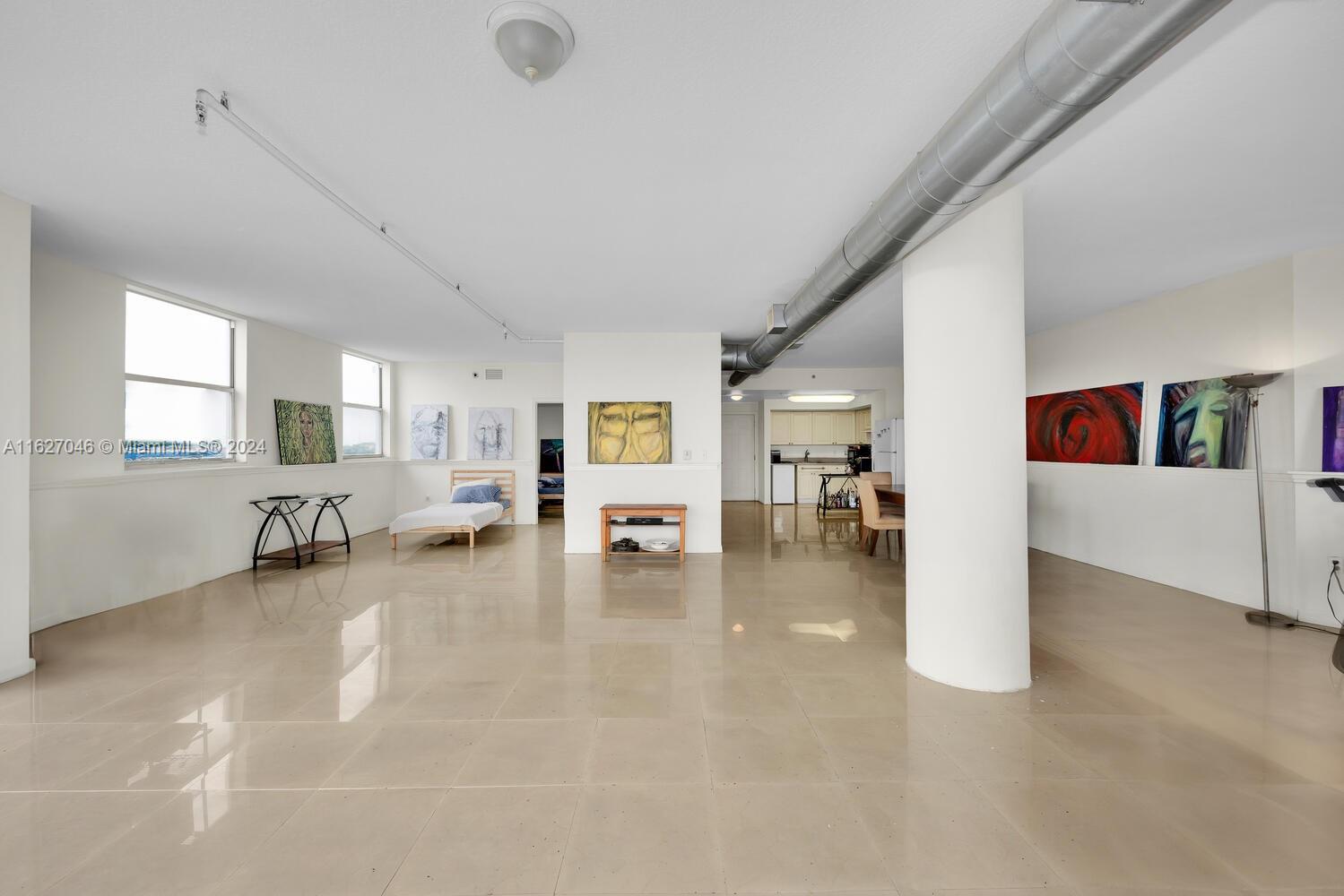 West Flagler Miami, FL 33125 - Photo 7 of 29 a view of a livingroom with couch and white walls