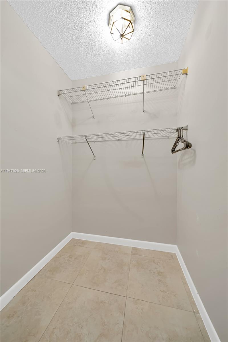 14325 Southwest 57th Lane, Unit 66 Miami, FL 33183 - Photo 19 of 22 a view of a room with racks on the wall