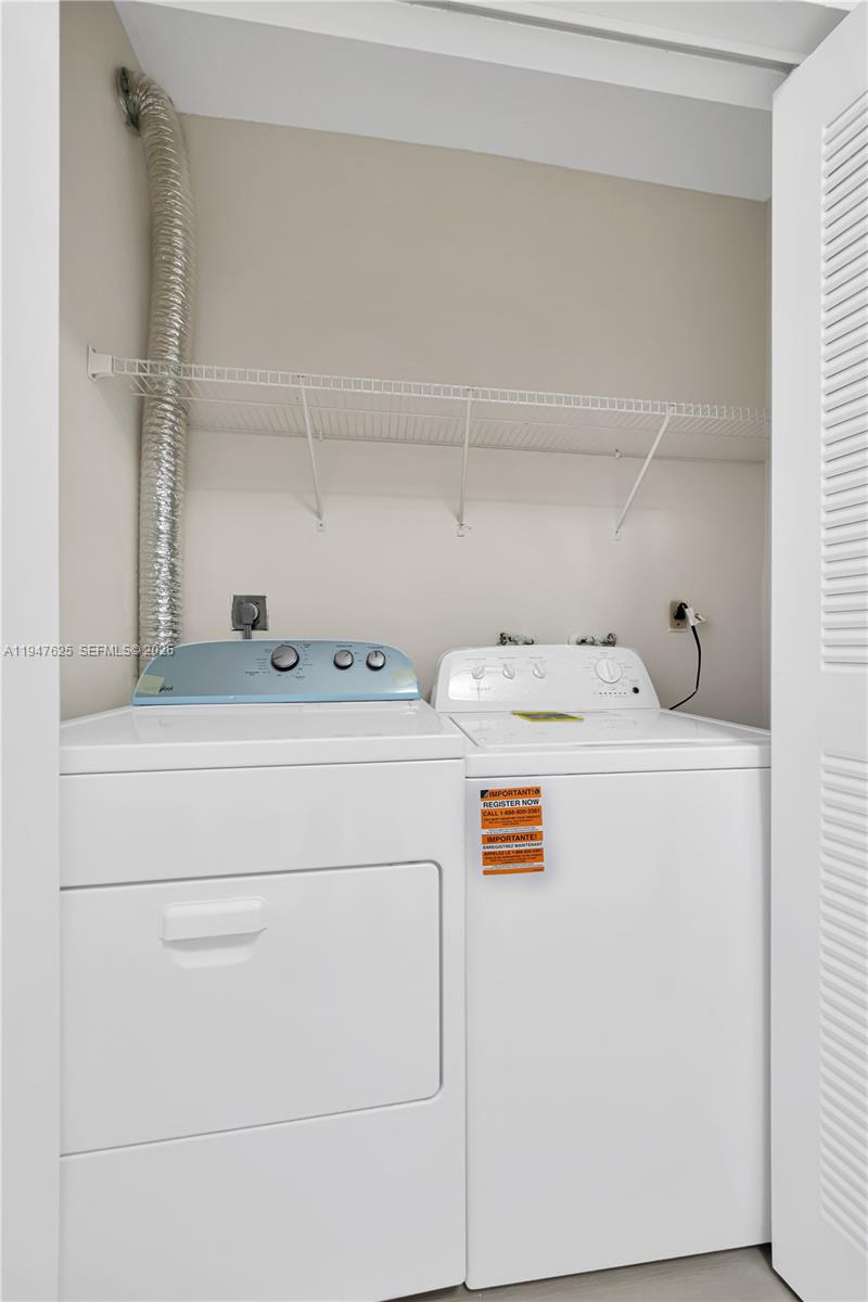 14325 Southwest 57th Lane, Unit 66 Miami, FL 33183 - Photo 20 of 22 a utility room with dryer and washer