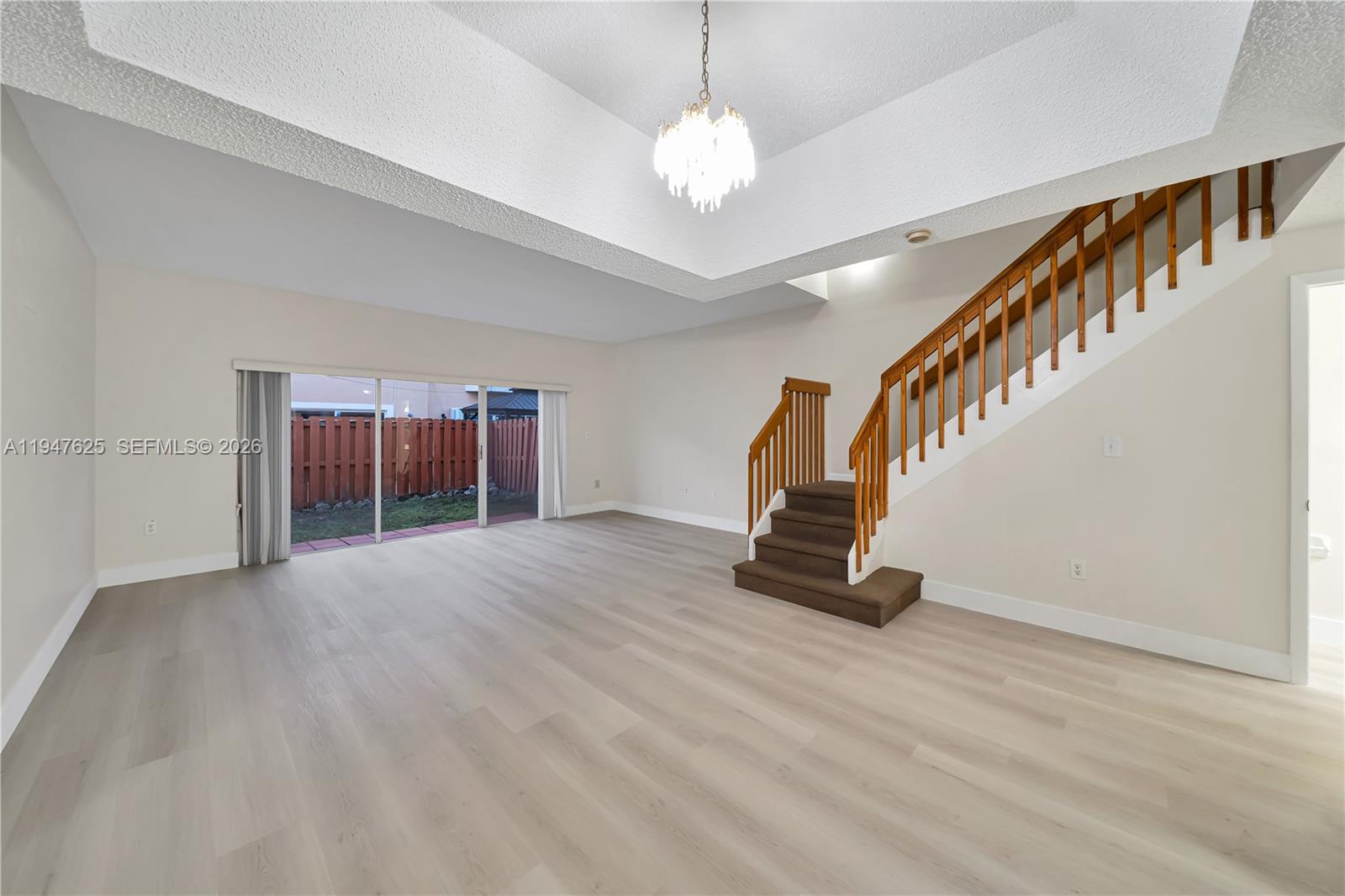 14325 Southwest 57th Lane, Unit 66 Miami, FL 33183 - Photo 2 of 22 a view of an entryway with wooden floor