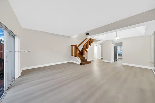 a view of a room with wooden floor and equipment