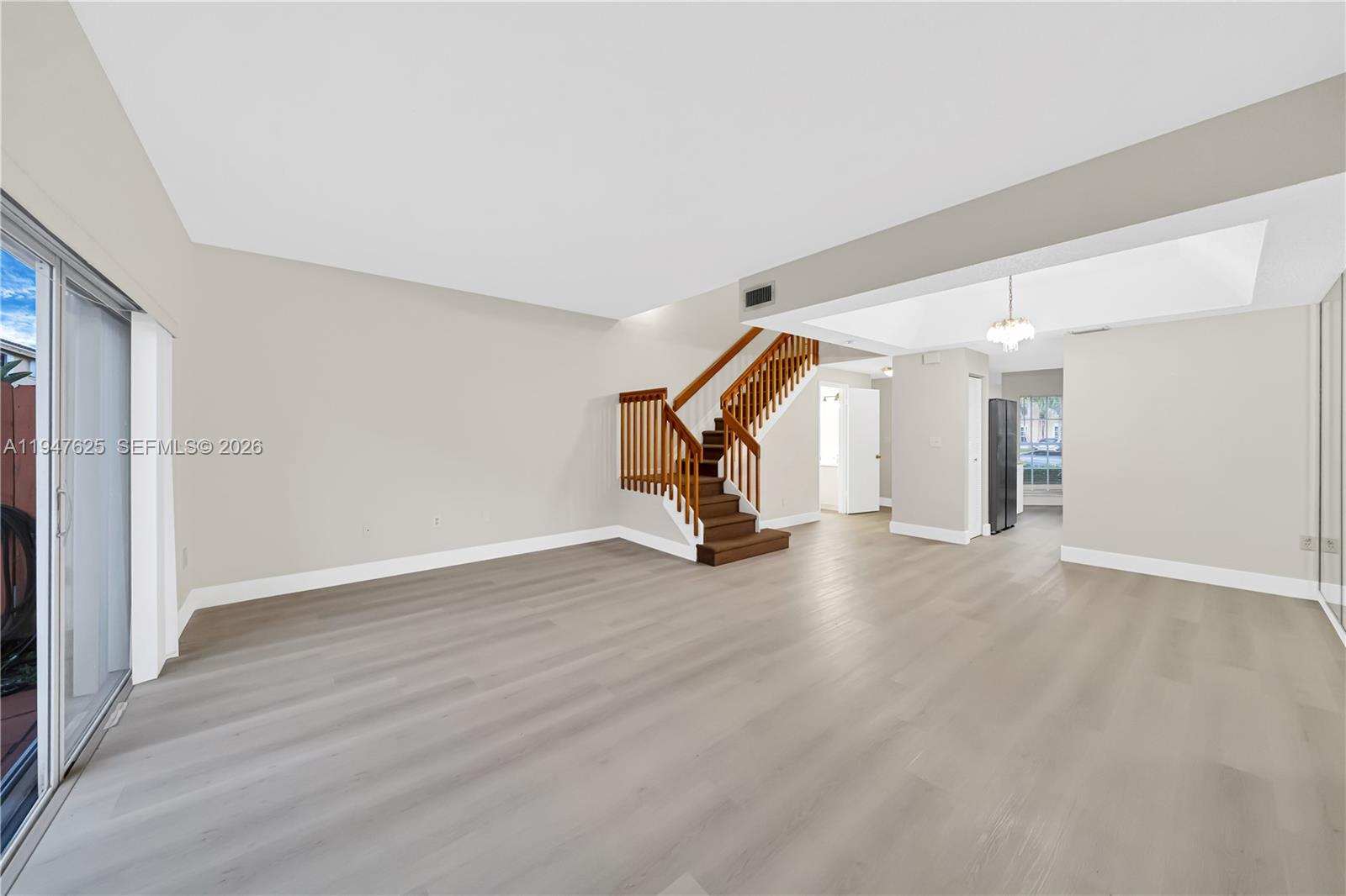14325 Southwest 57th Lane, Unit 66 Miami, FL 33183 - Photo 4 of 22 a view of a room with wooden floor and equipment