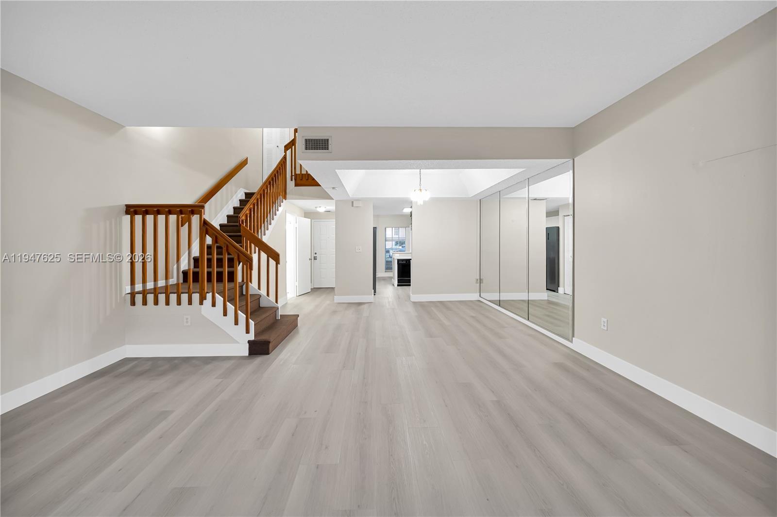 14325 Southwest 57th Lane, Unit 66 Miami, FL 33183 - Photo 5 of 22 a view of a hallway with wooden floor and stairs