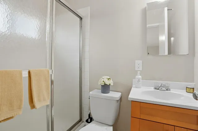 a bathroom with a sink toilet and vanity