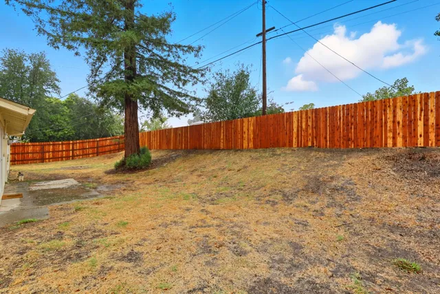 a view of a backyard of the house