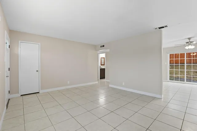 a view of an empty room and window