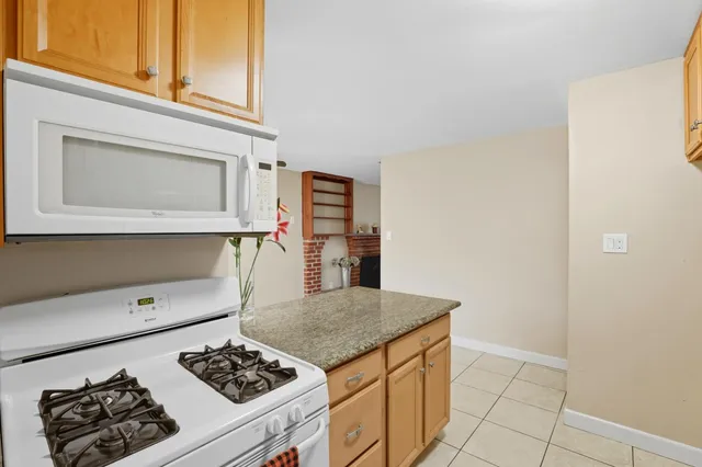 a kitchen with a stove and a microwave
