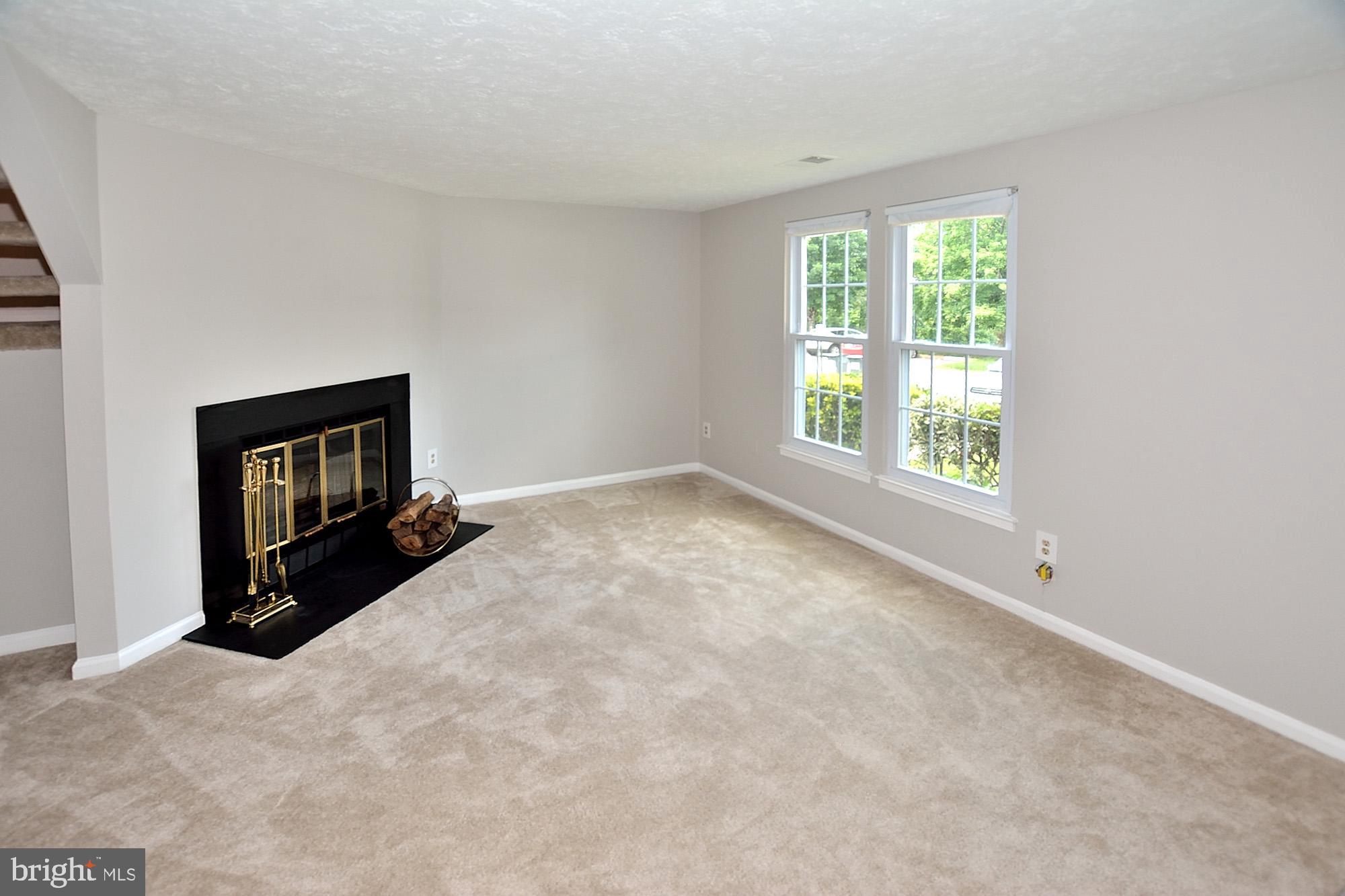 7475 Lone Star Road Lorton, VA 22079 - Photo 2 of 22 Living room with wood burning fireplace